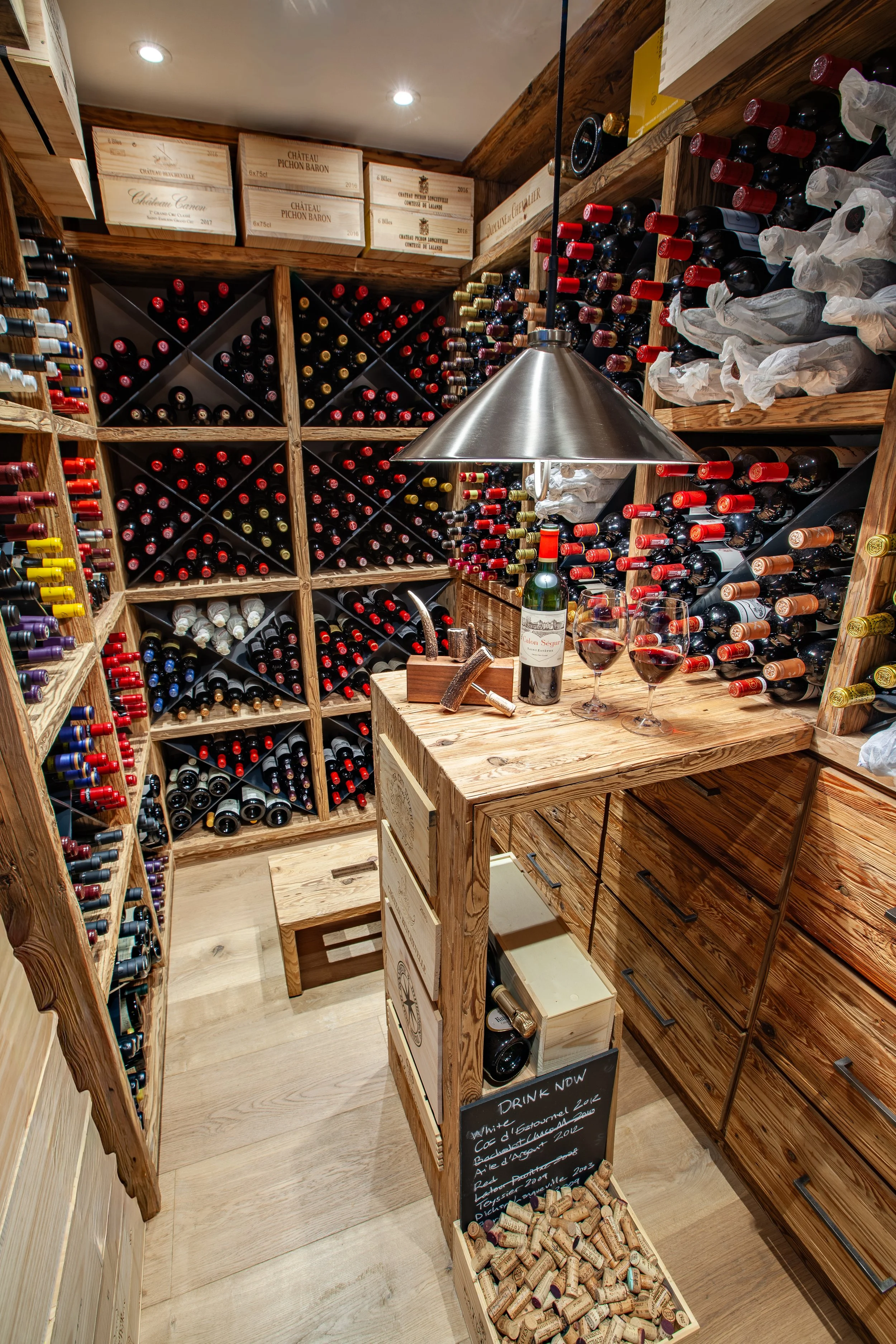 ully stocked wine cellar with Bordeaux and Burgundy selection, Chalet la Vigne Verbier luxury ski chalet Switzerland