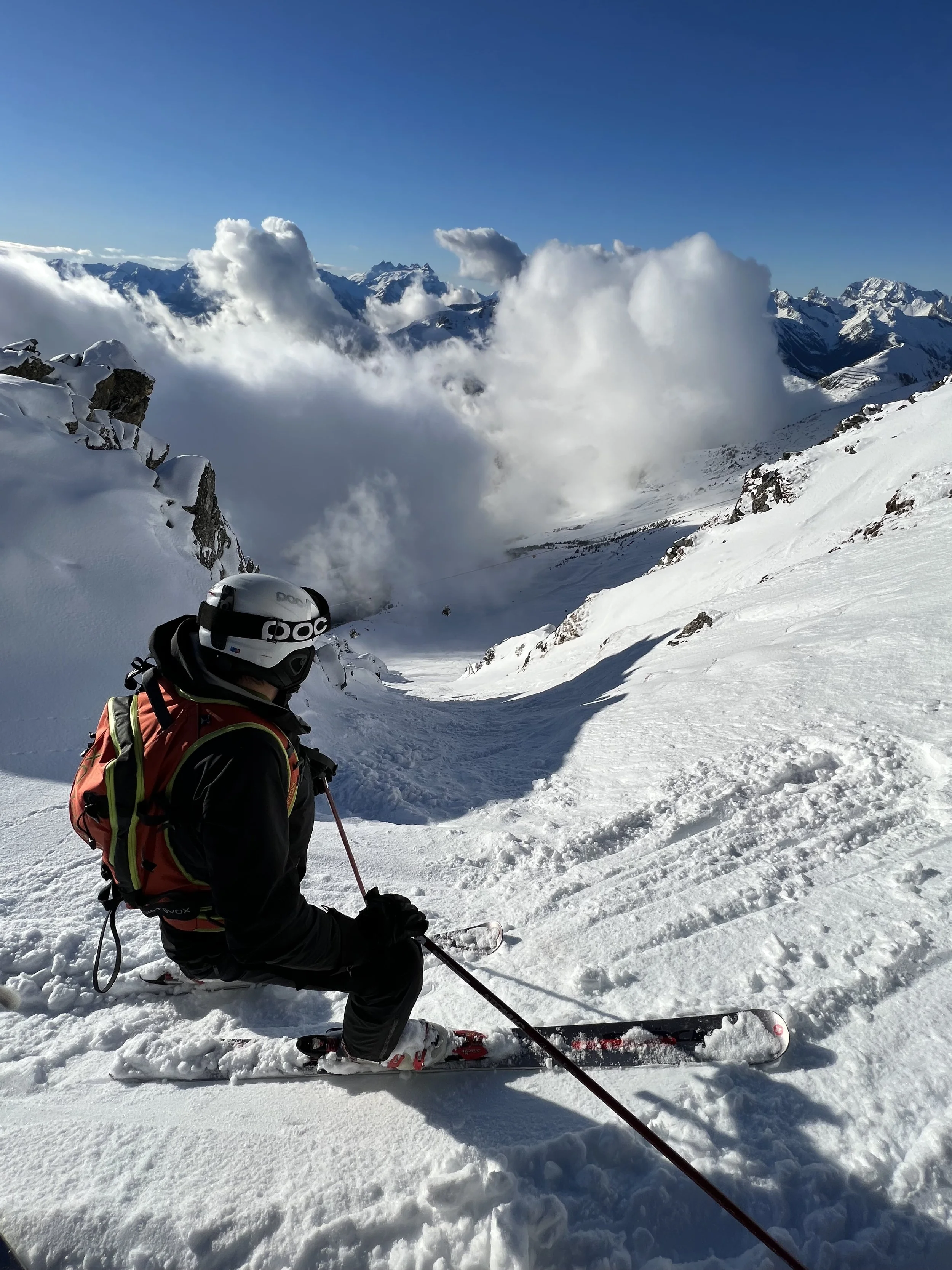 Skier at the top of the Number One Couloir, Verbier, Switzerland