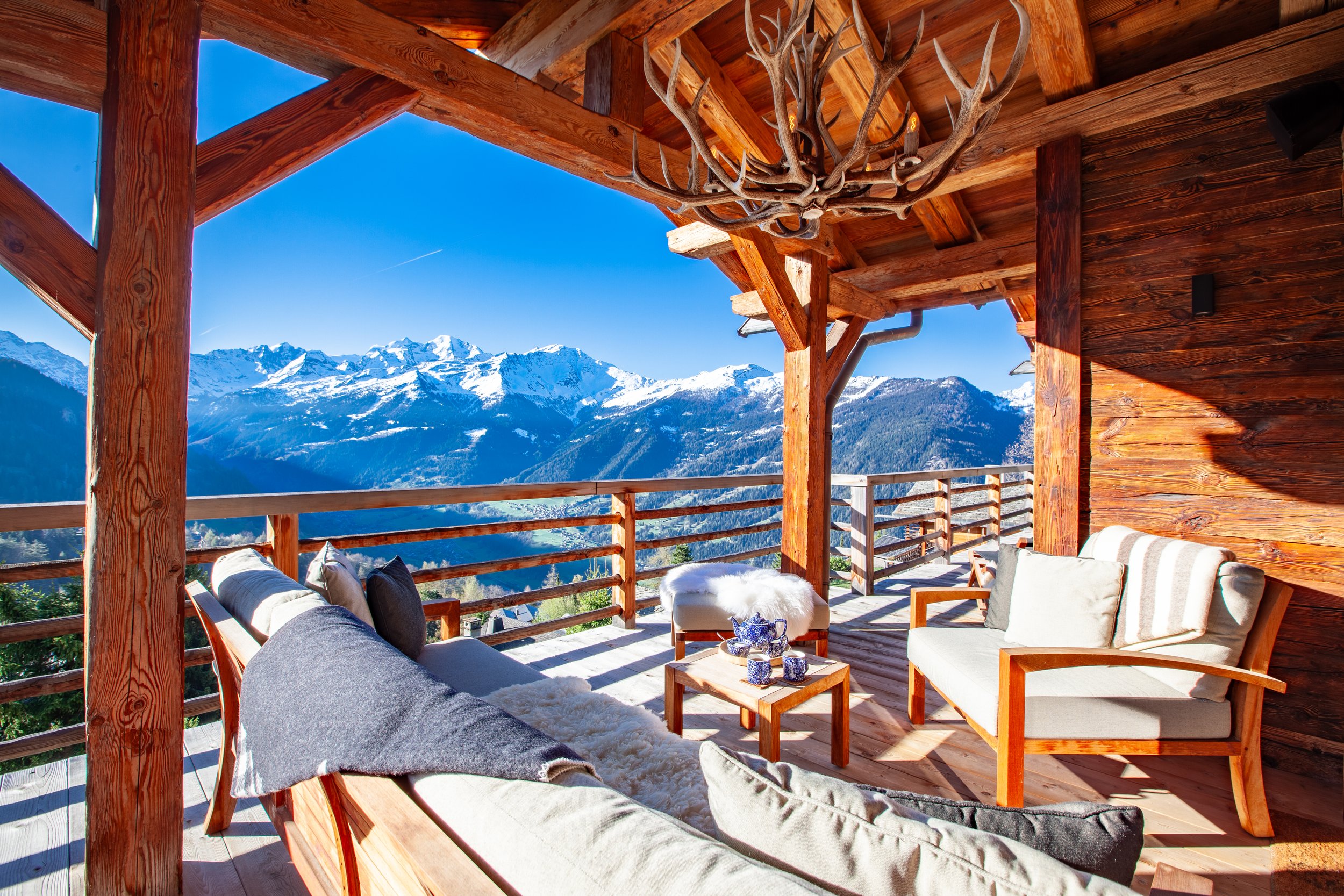 Covered terrace panoramic view of Verbier and surrounding Alpine peaks, Chalet la Vigne Switzerland