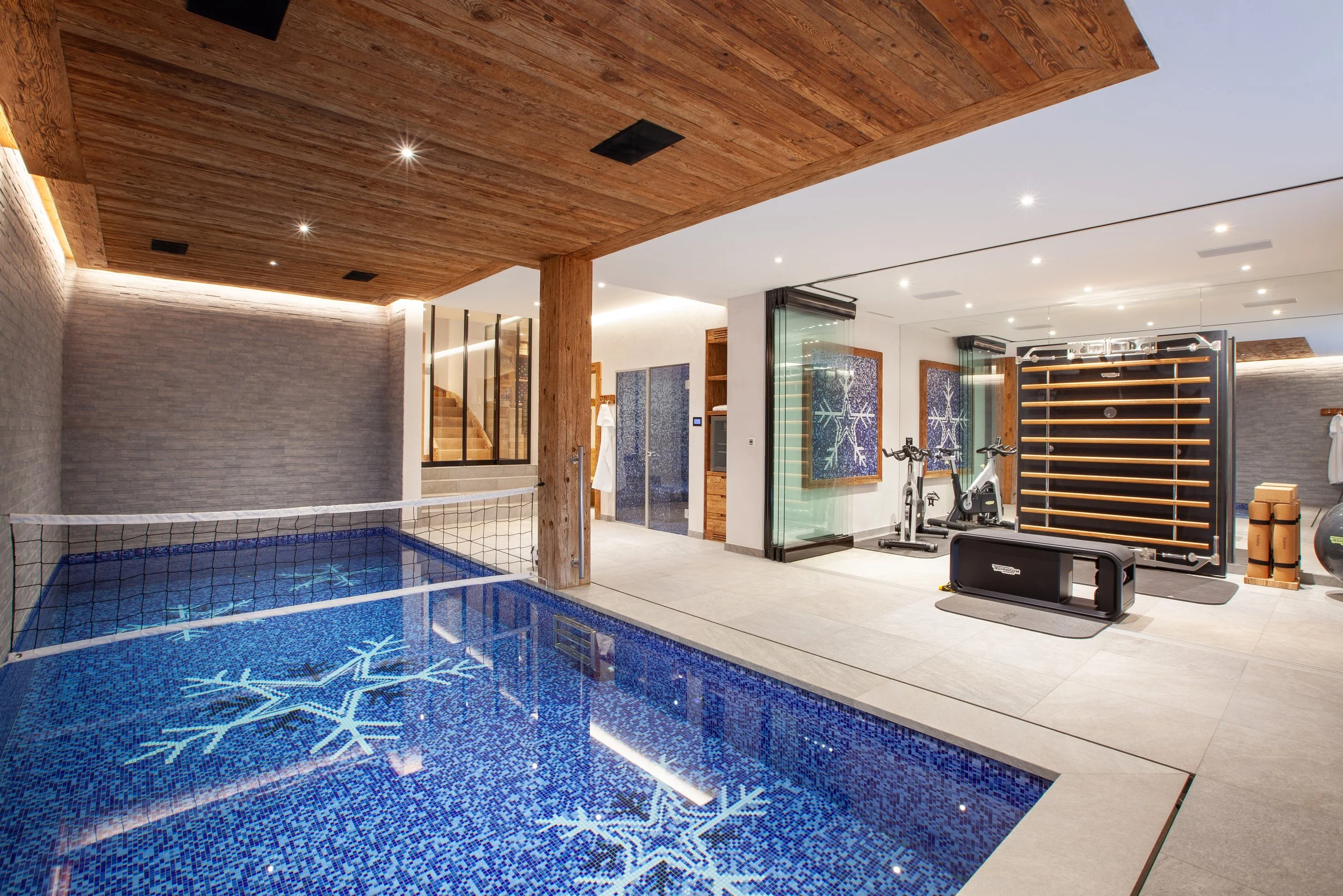 Indoor swimming pool with gym and steam room, Chalet la Vigne Verbier luxury ski chalet Switzerland