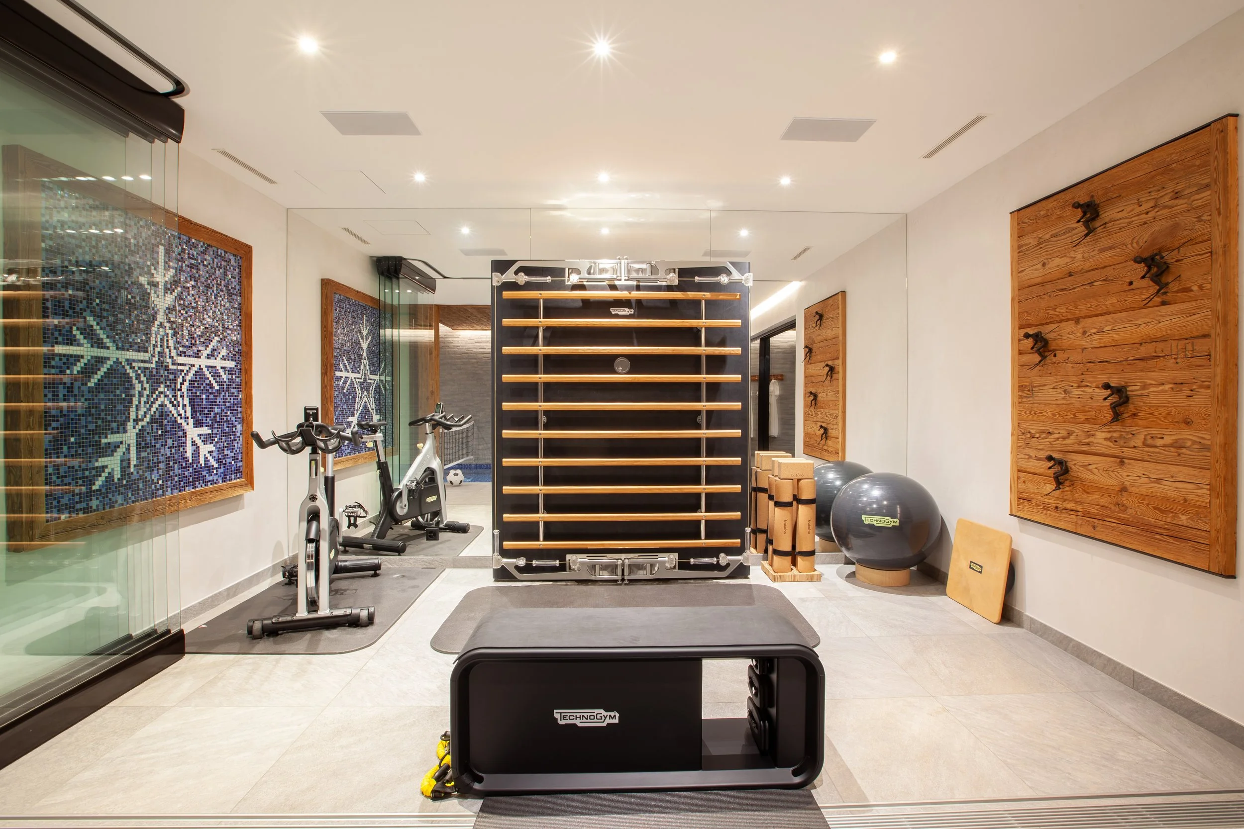 Technogym Kinesis gym with weights and exercise bike, Chalet la Vigne Verbier luxury ski chalet Switzerland