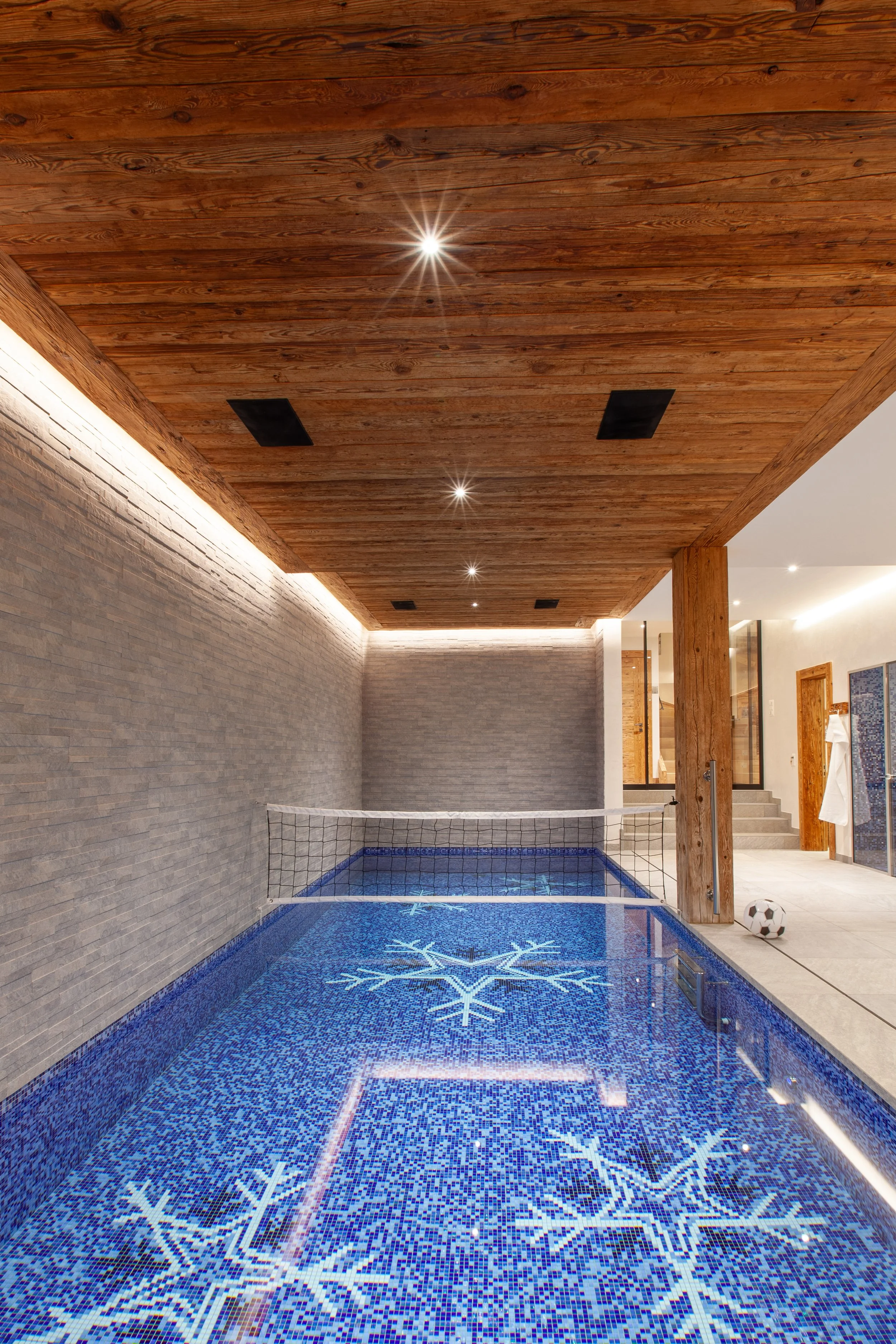 Indoor swimming pool with Sicis mosaic snowflake tiles and Bowers & Wilkins speakers, Chalet la Vigne Verbier Switzerland