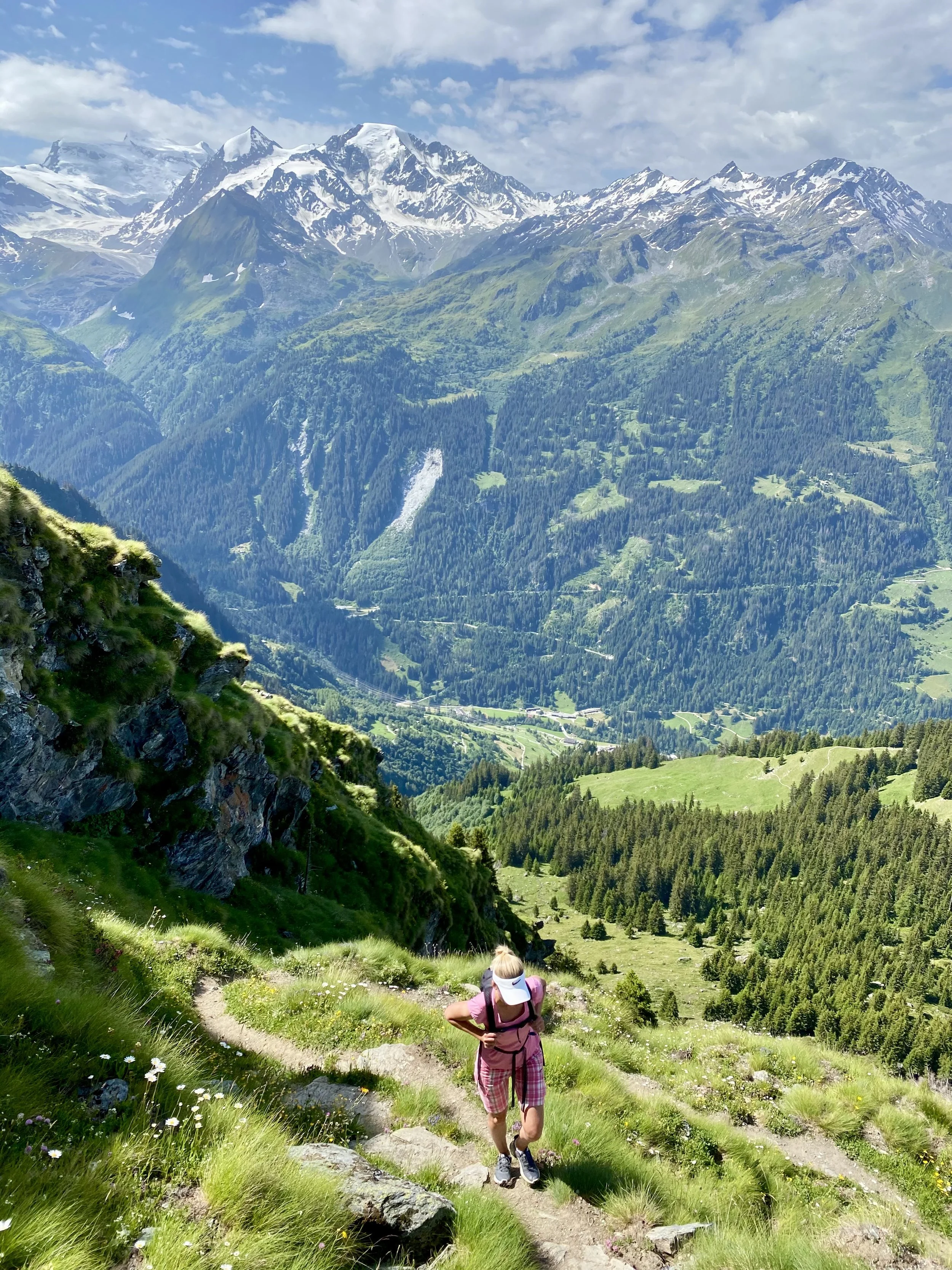 Woman hiking up from Lourtier to the Cabane Mont Fort at Verbier, Switzerland