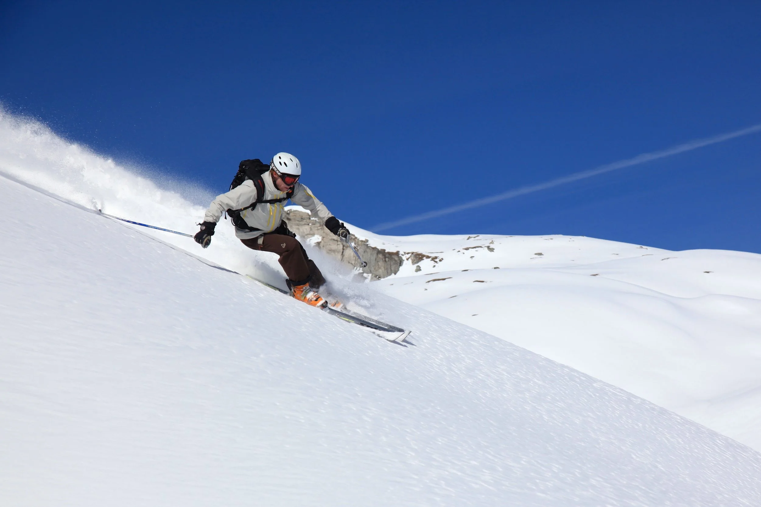 Skier descending the apron on Mont Rogneux off-piste, Verbier Switzerland