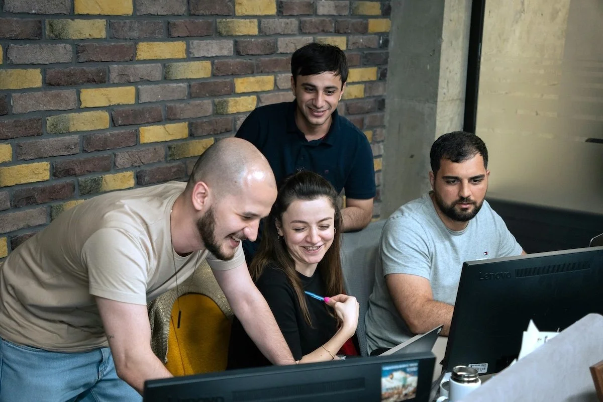 Team of information technology professionals working together