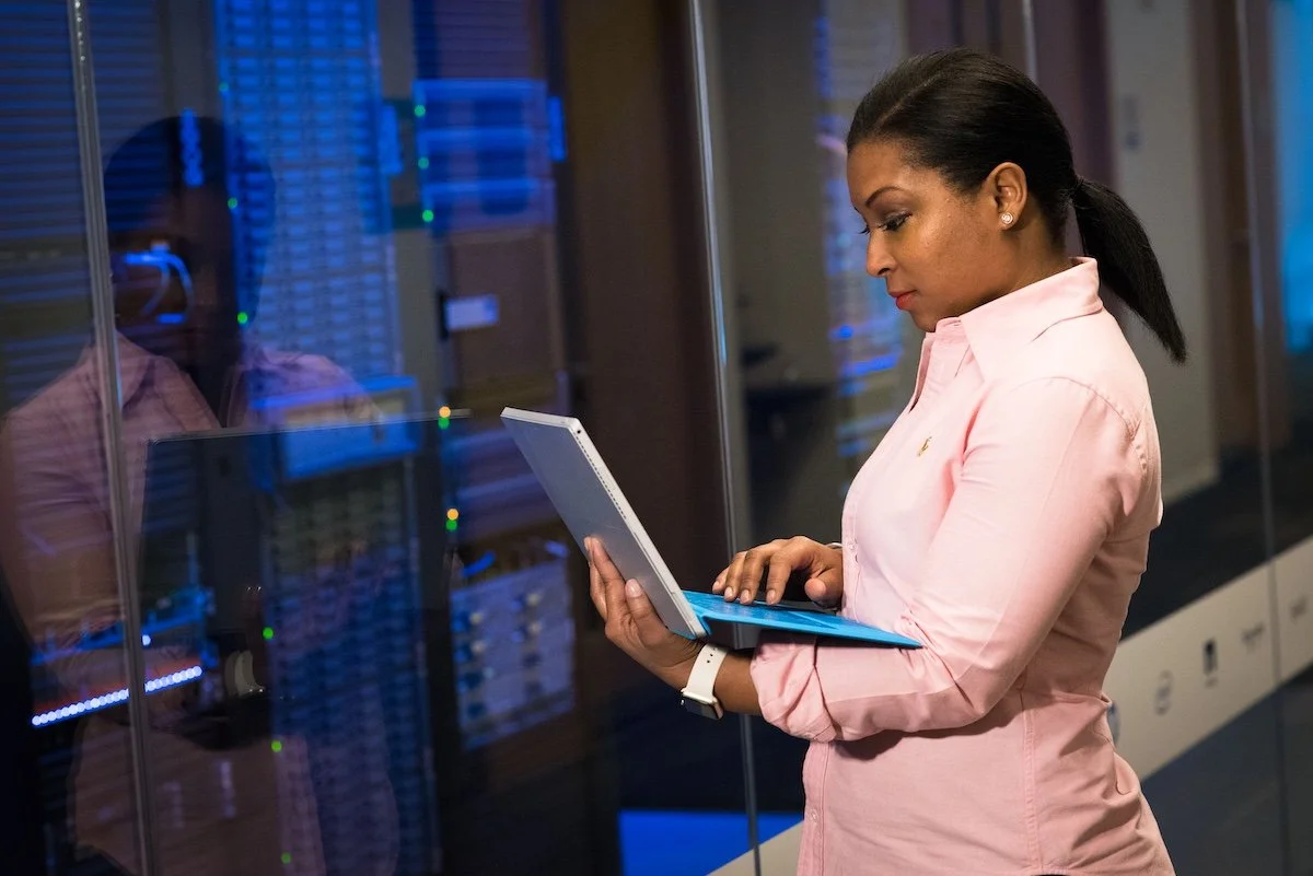 Female technical expert working on a computer
