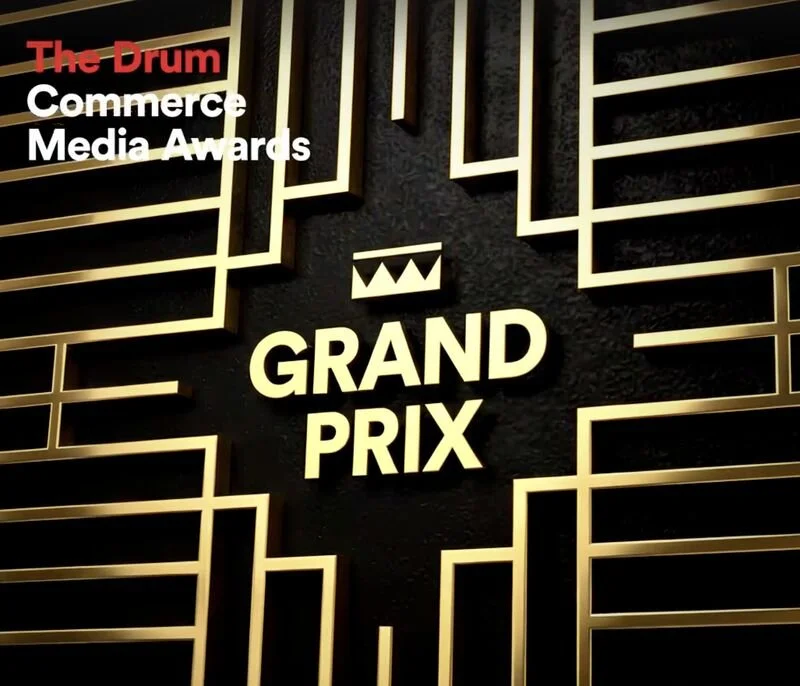 Black and gold sign for Grand Prix at The Drum Commerce Media Awards.