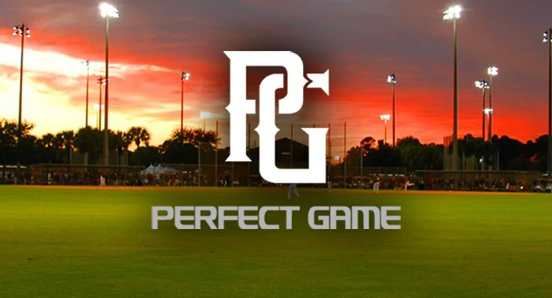 Baseball field at sunset with a large logo of PG and the words 'Perfect Game' in front.