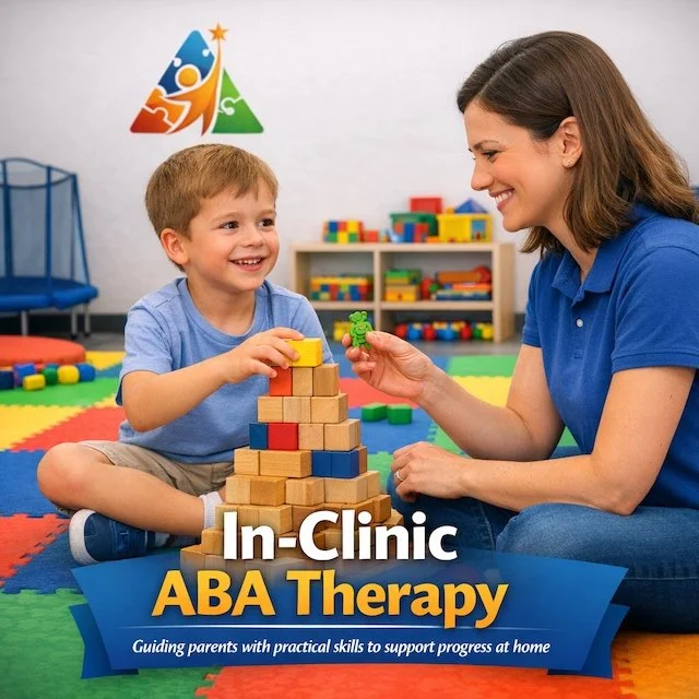 A young boy and a woman smiling and playing with wooden building blocks in a playroom. The boy is holding a toy, and the woman is handing him a small green toy. There are colorful educational toys and a shelving unit in the background. The text on the image reads "In-Clinic ABA Therapy" with a subtitle "Guiding parents with practical skills to support progress at home."