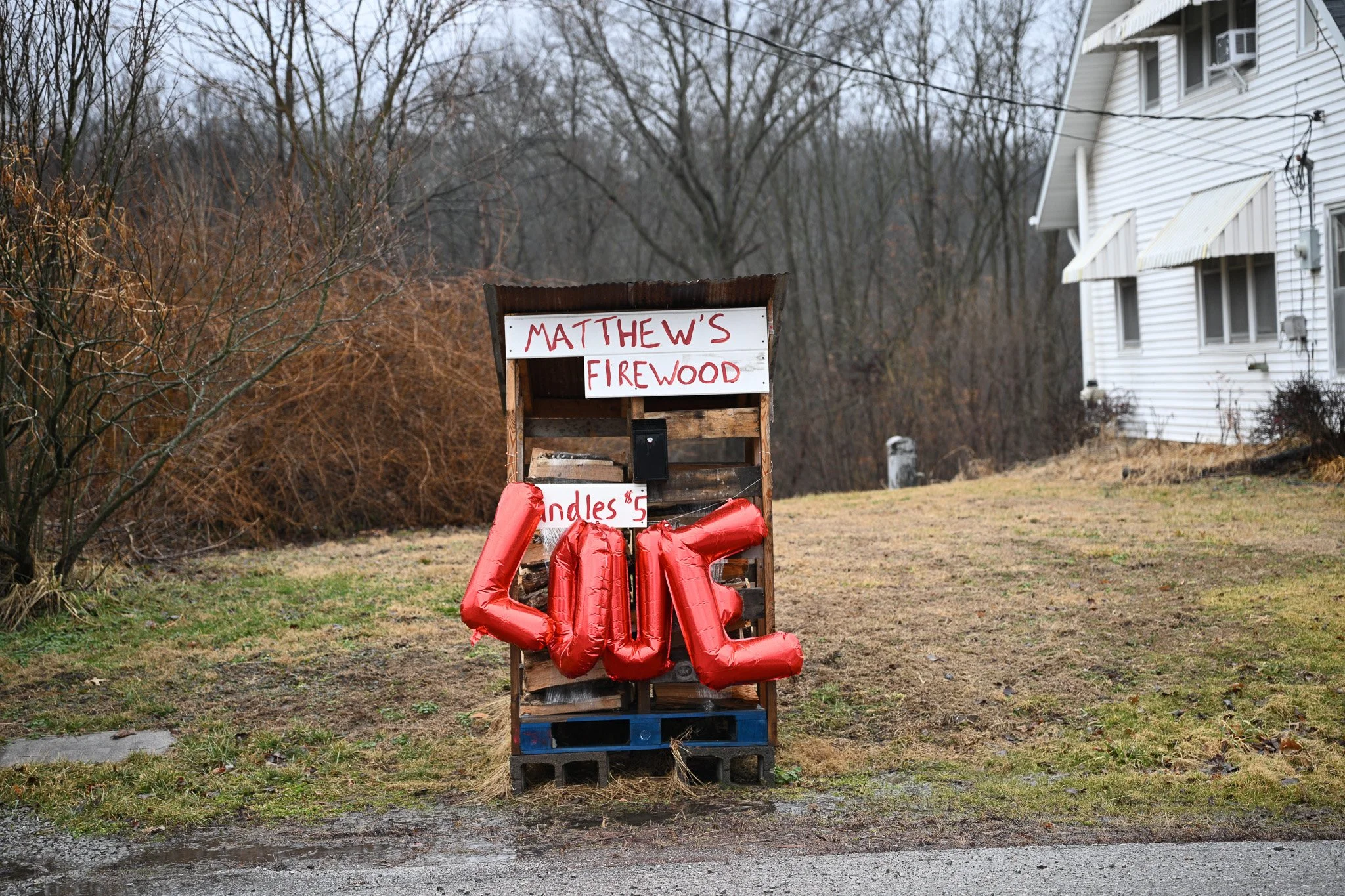 A Valentine’s Day decoration hangs on a roadside firewood during the Rocheport Chocolate Crawl on
Saturday, Feb. 14, 2026, in Rocheport, Mo. The annual event brings visitors to local businesses to collect
chocolate from participating vendors.
