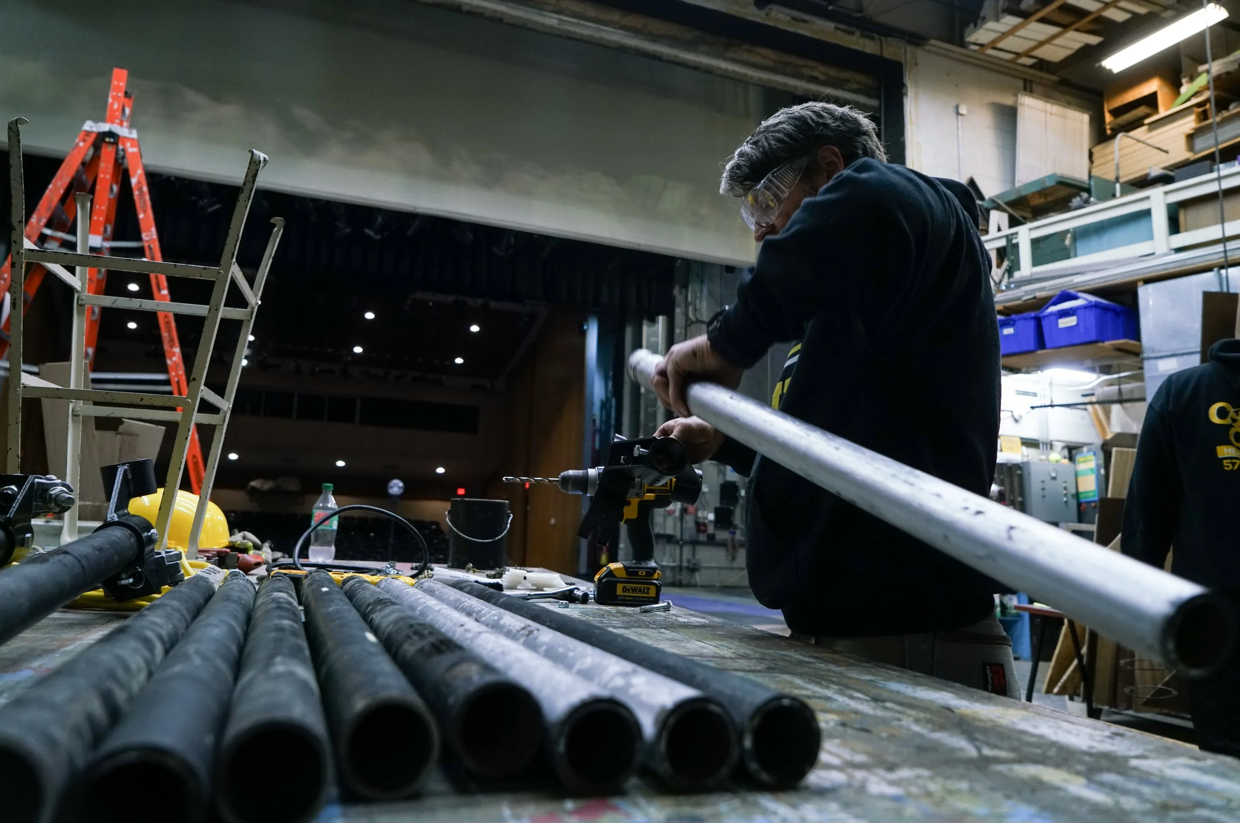 Zach Alley works on drilling holes into pipes during set construction. “I love building items, such as props or scenic elements for a show,” he said. “It’s quick to put something together and see it come to life.”
