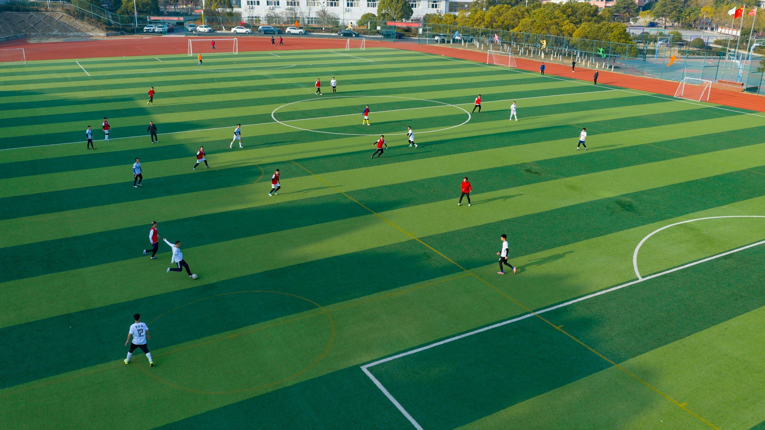 Soccer pitch with 2 teams playing each other. 