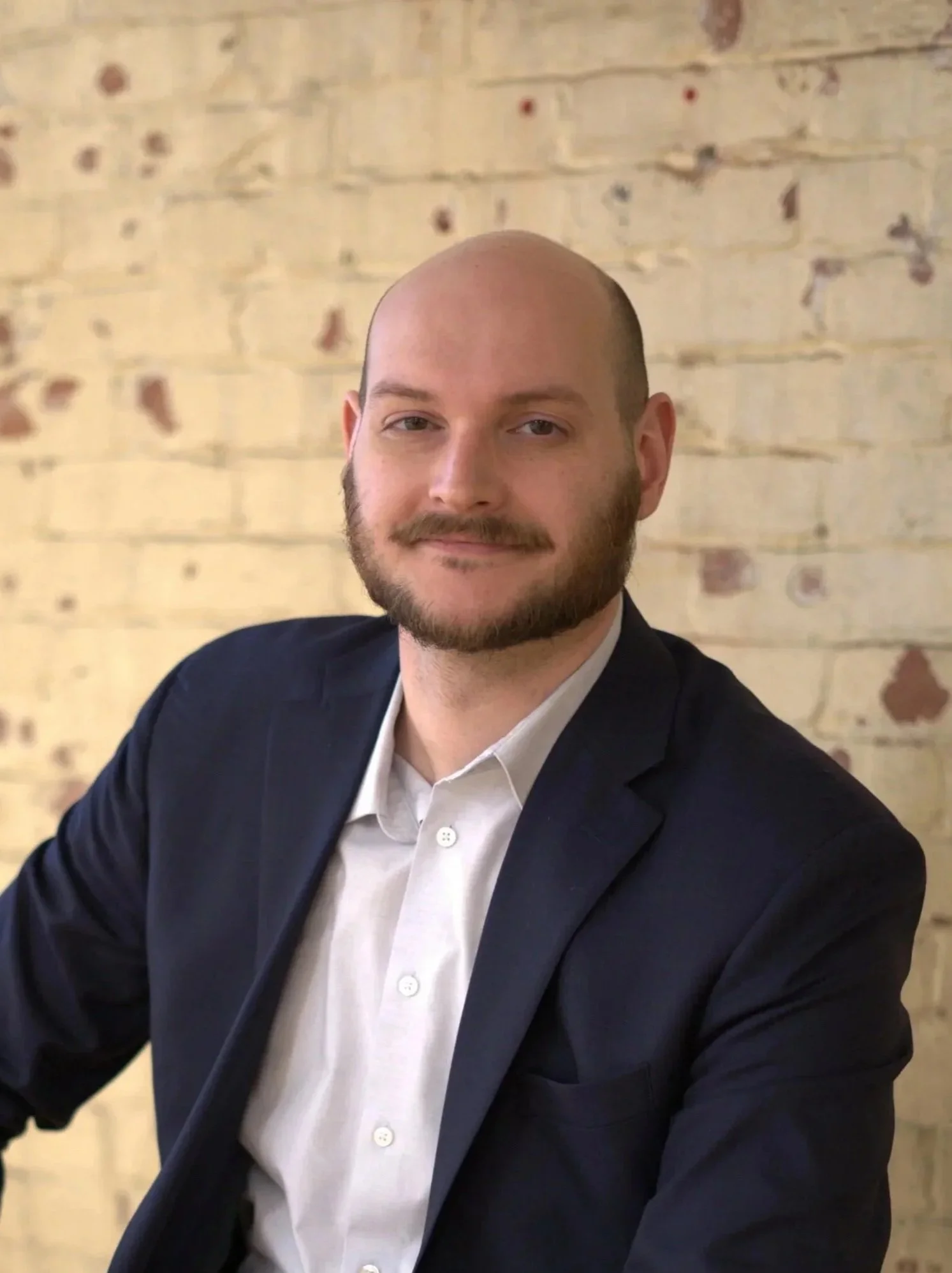 Democratic candidate seated portrait, Berks County Pennsylvania campaign image focused on leadership and community representation. Berks county representative.
