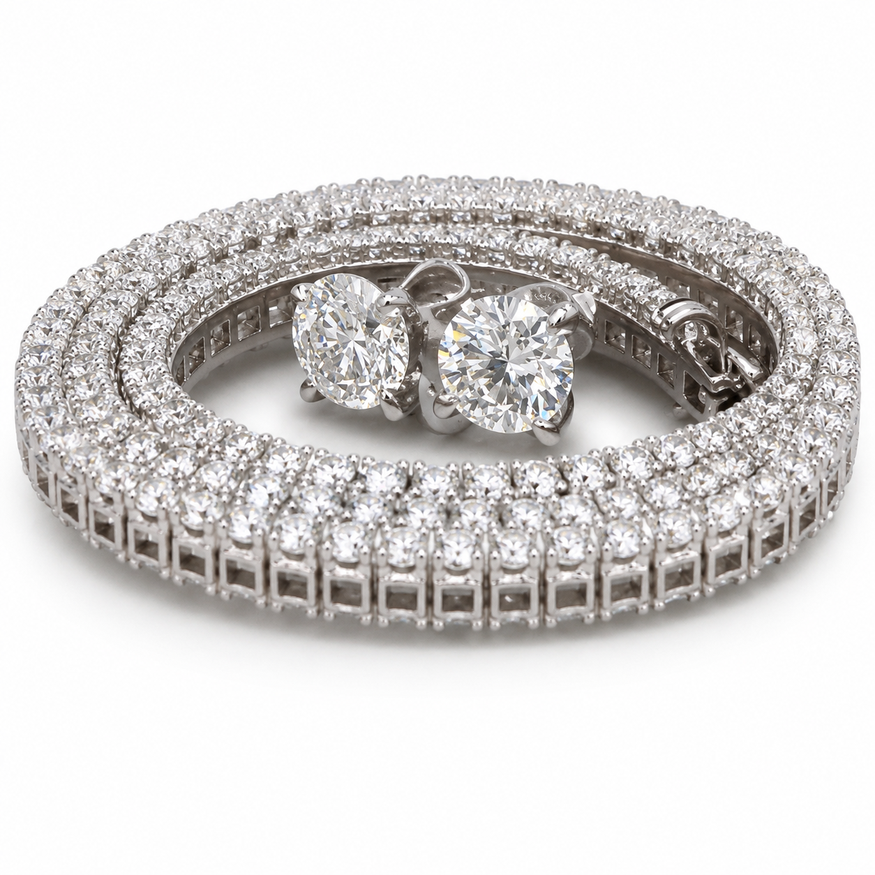 A set of sparkling diamond jewelry including a necklace, a bracelet, and a pair of earrings.