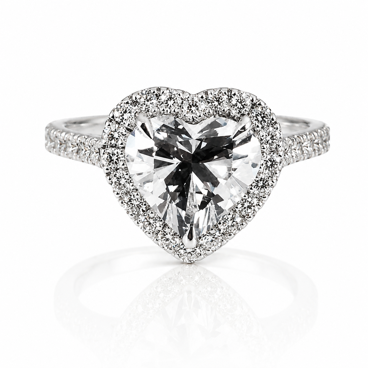 A diamond engagement ring with a heart-shaped center stone surrounded by a halo of smaller diamonds and a diamond-encrusted band.