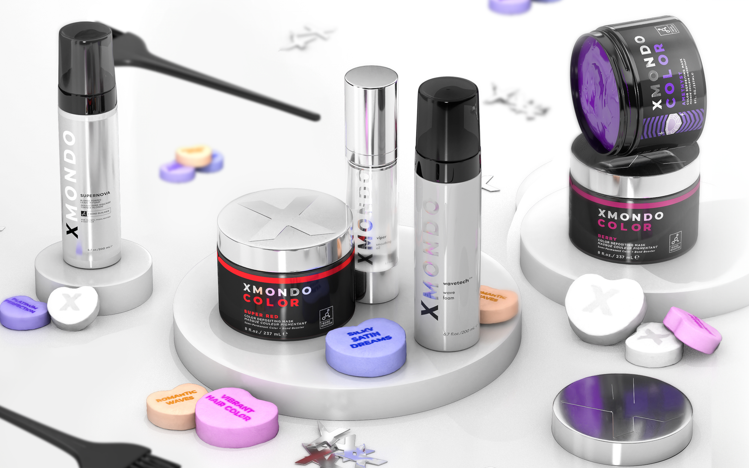 Collection of hair and skin care products, including XMONDO Color masks, serums, and ointments, on a white display stand with decorative snowflake embellishments.