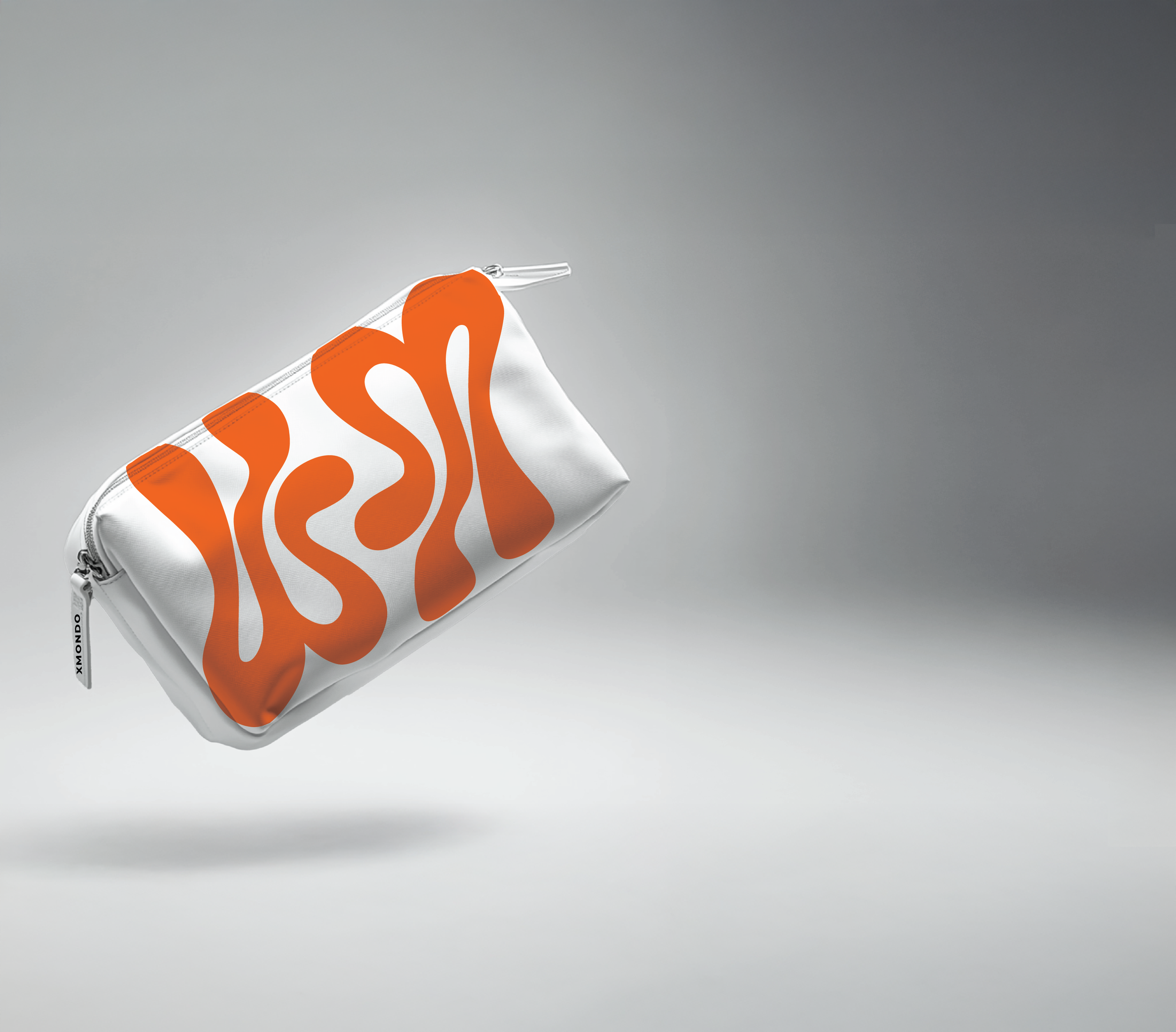 White zipper pouch with orange abstract design, partially visible on a plain gray background.
