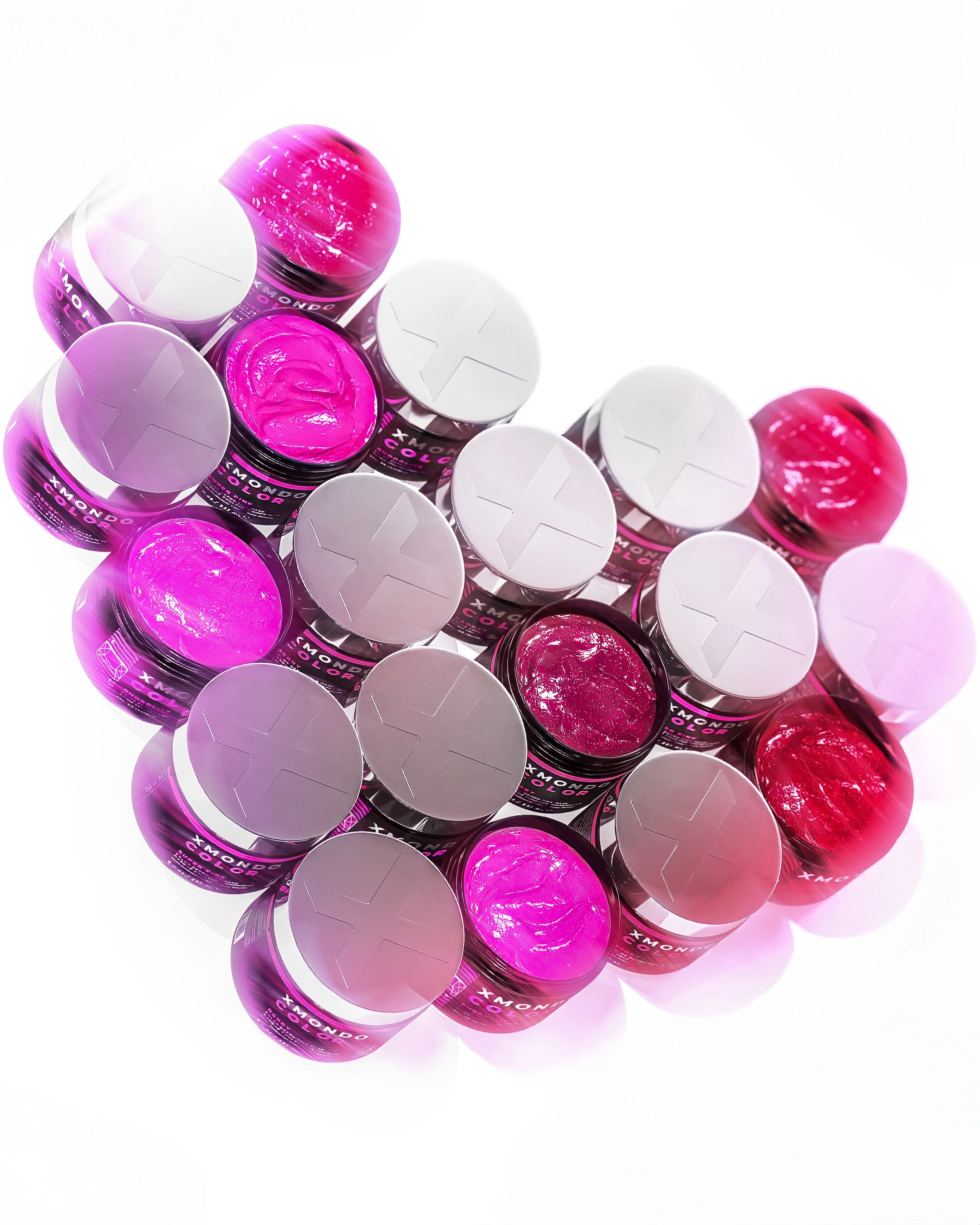 Multiple containers of pink and purple gel polish with white caps, arranged on a white background.