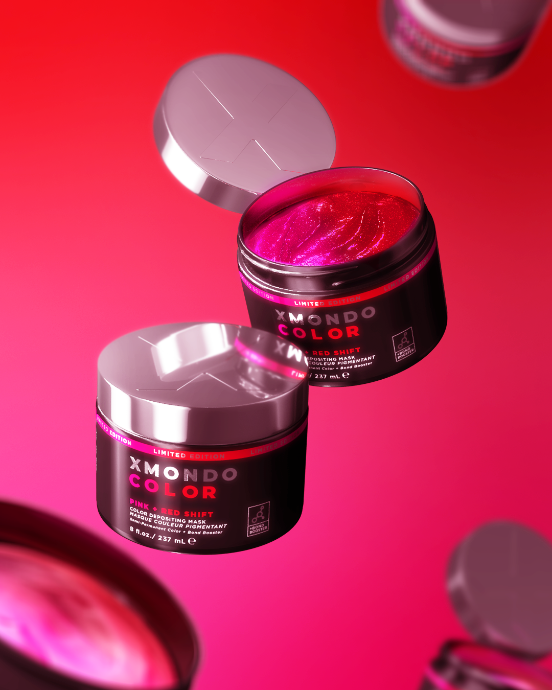 Open container of XMONDO COLOR pink-red shift face pigment with metallic finish on a bright pink background, surrounded by other similar containers.
