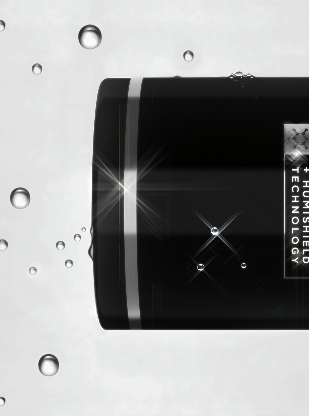 Close-up of a black skincare or cosmetic product container with water droplets, set against a white background with floating bubbles, and the text '+ HUMISHIELD + TECHNOLOGY' on the label.