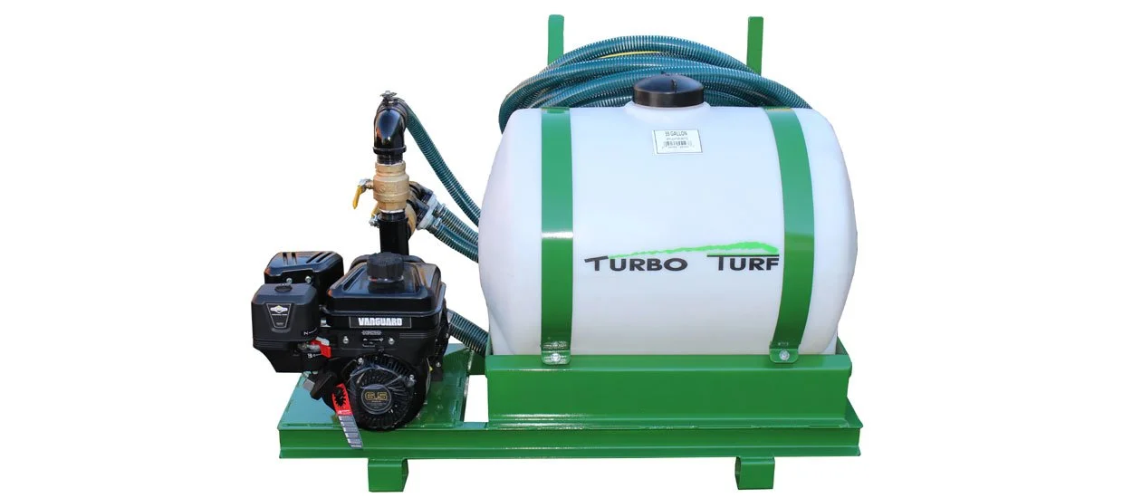 Green and white turf irrigation system with a tank and a small gas engine labeled 'Vanguard,' connected by hoses.