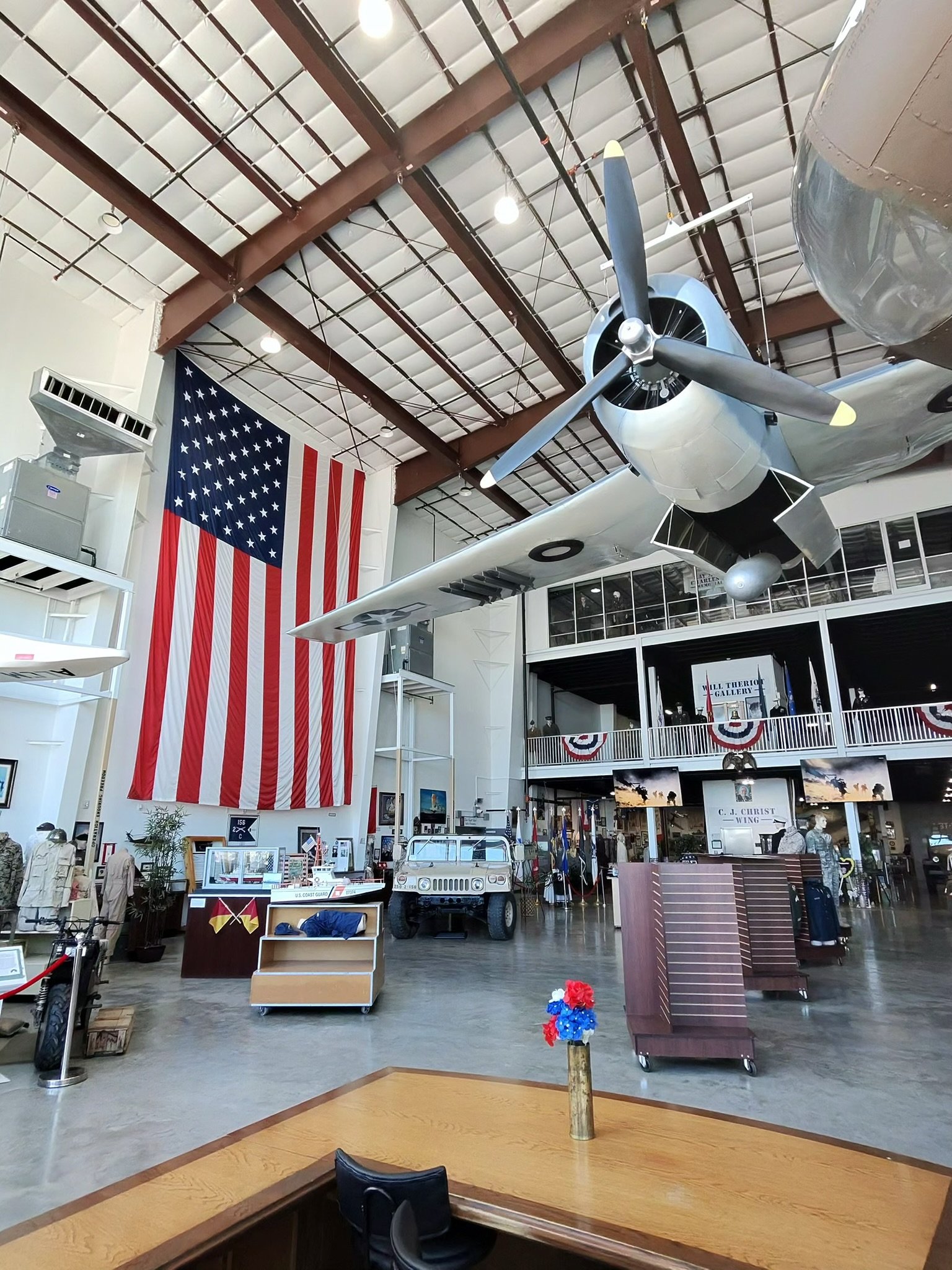 Regional Military Museum hangar in Houma with a vintage fighter plane and American flag