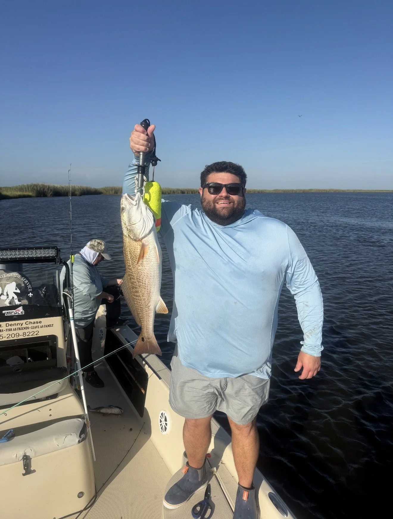Matthew James of James Media LA holding a redfish on a Louisiana fishing trip