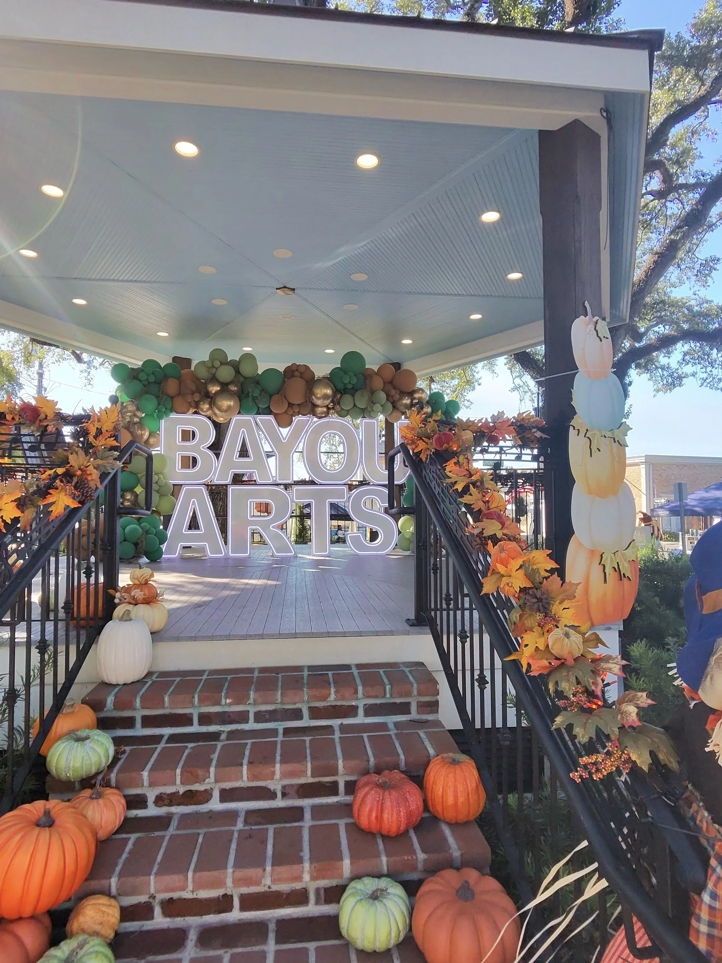 Bayou Arts Fest sign in the downtown Houma gazebo decorated for fall