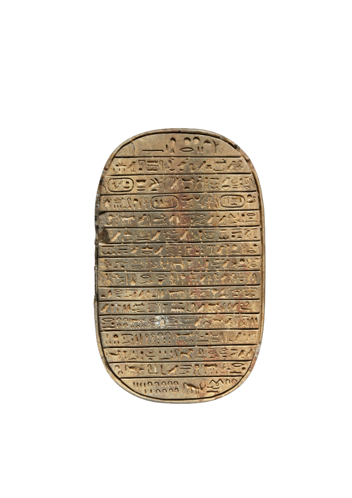 Ancient Egyptian scarab-shaped artifact with hieroglyphic inscriptions.