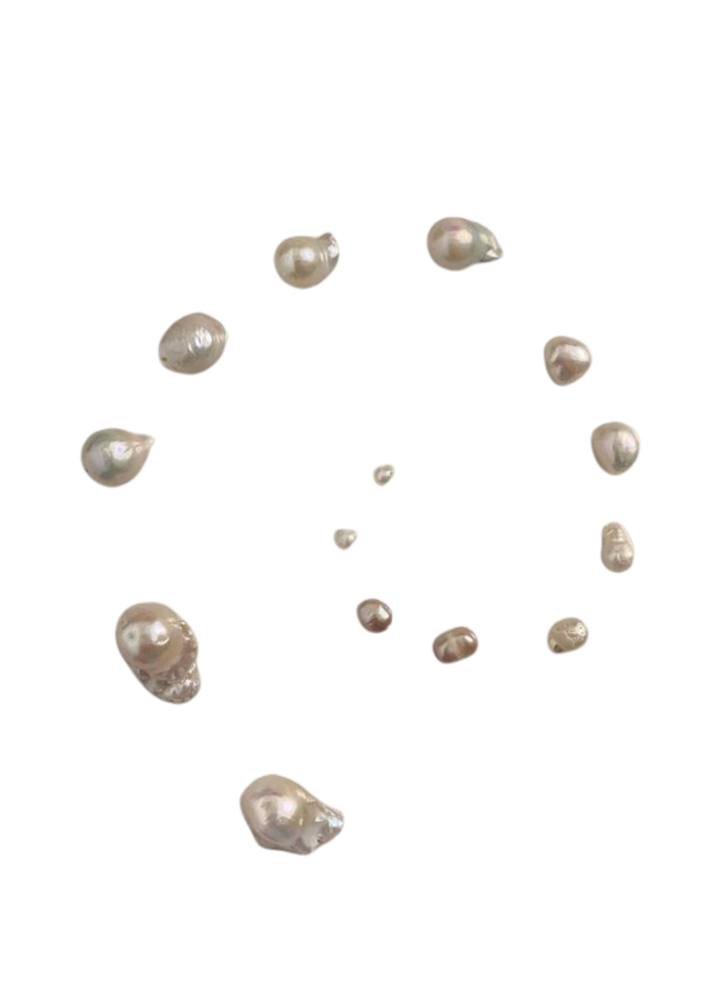 Close-up view of several irregularly shaped pearls scattered on a black background.