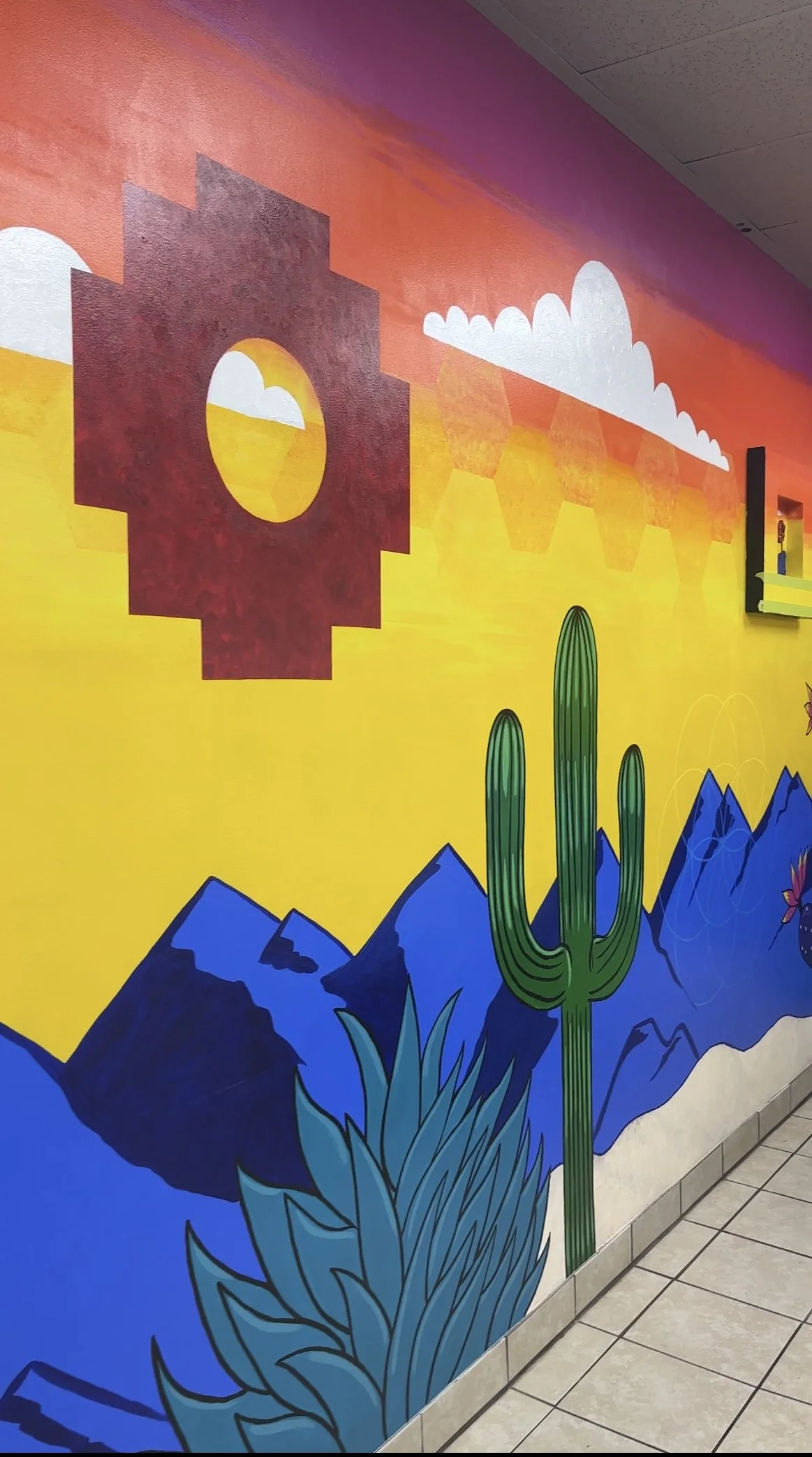 Mural bright bold New Mexico restaurant sacred geometry