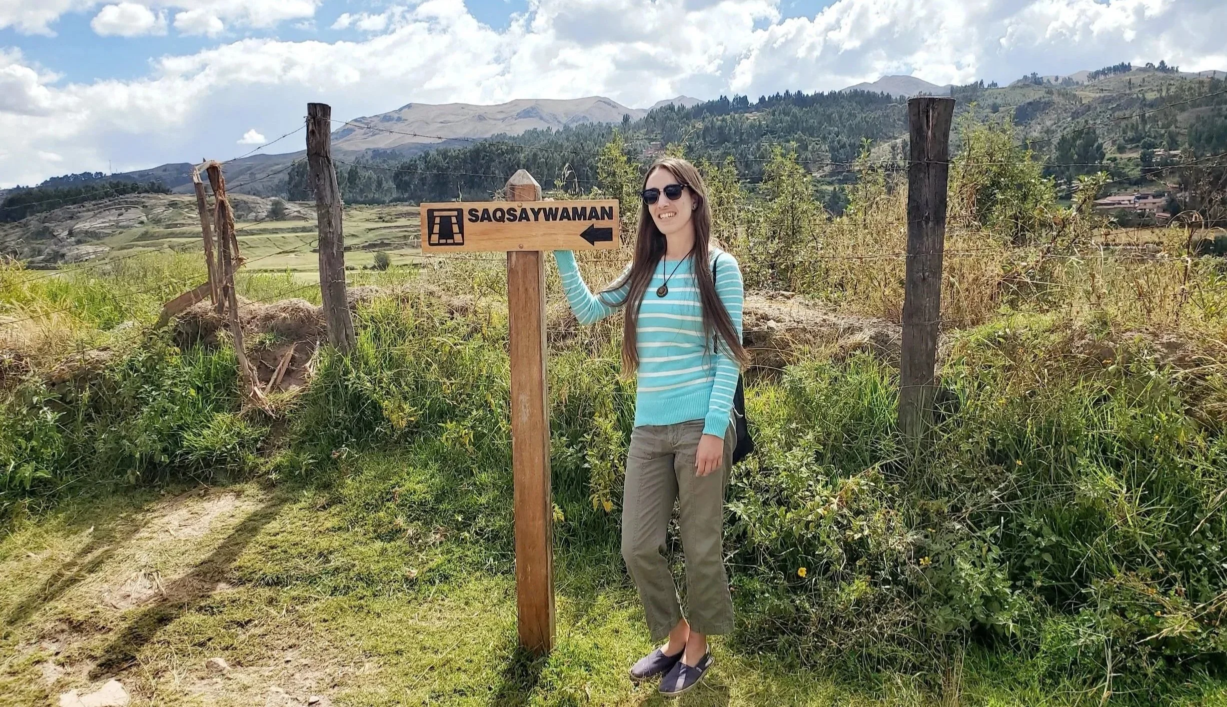 Setting off to explore ancient Inca ruins at the Saqsaywaman entrance in the high Andes of Peru.