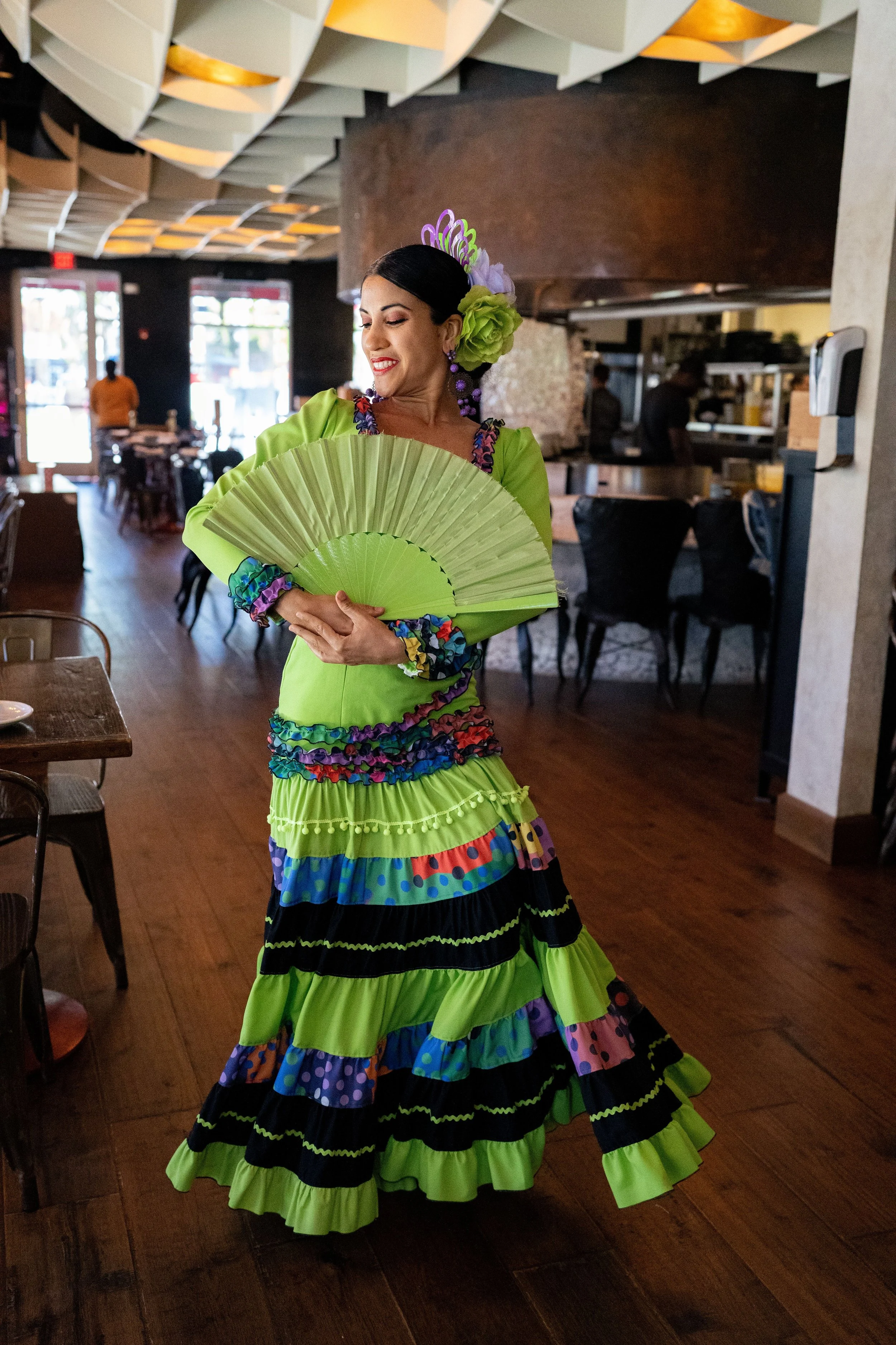Authentic flamenco dancer performing live in an intimate historic venue in Seville, Spain.