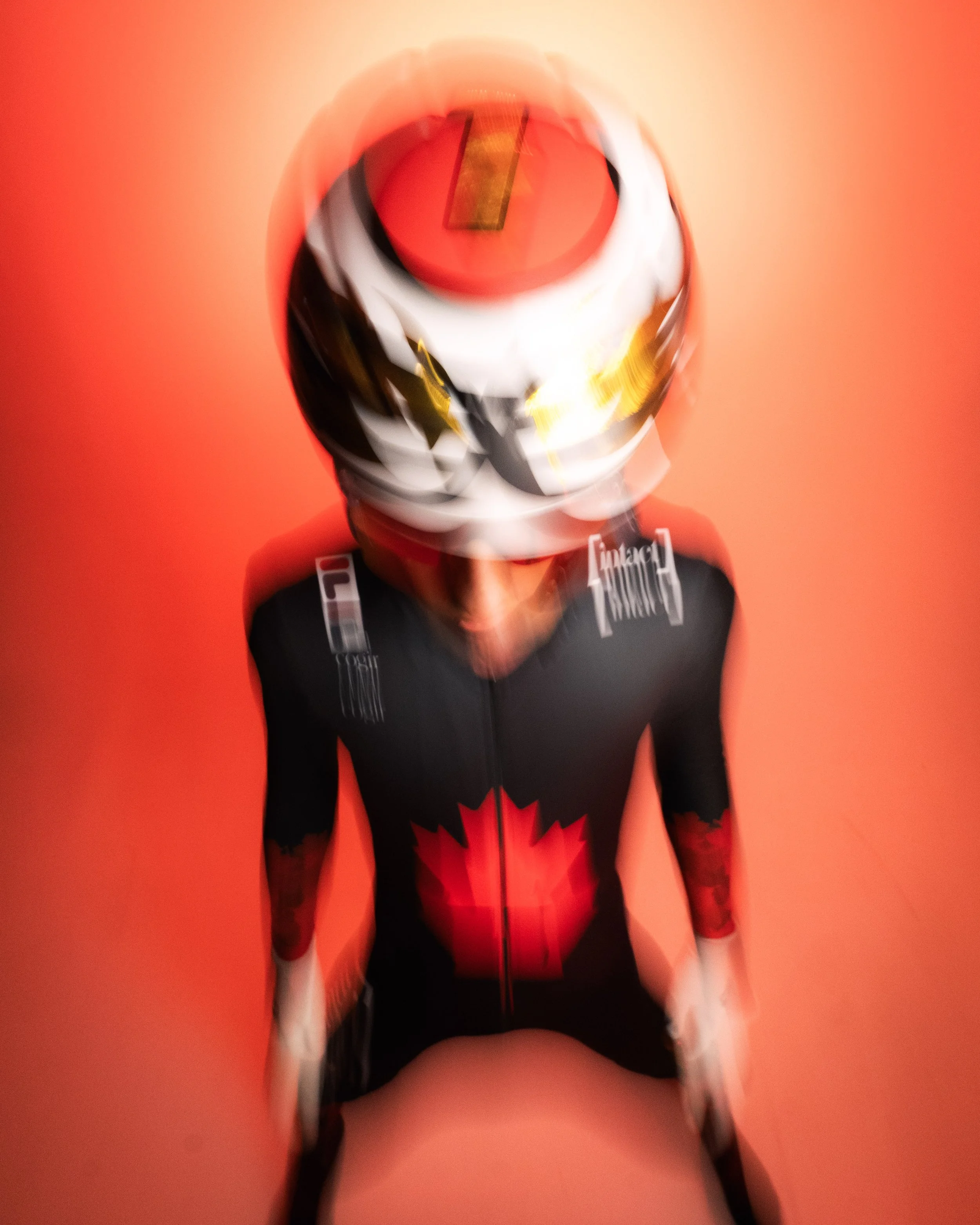 Bicycle helmet with a star design on a person's head against a red background.