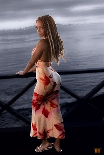 Woman in a floral skirt standing on a balcony overlooking the ocean at sunsetPhotographer, for hire, Oceanside, Carlsbad, San Diego, Orange County, Fashion, Portraits, Moments, Lifestyle, Events, Branding.
