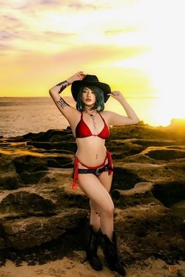 Photographer, for hire, Oceanside, Carlsbad, San Diego, Orange County, Fashion, Portraits, Moments, Lifestyle, Events, Branding.Woman in red bikini and black hat standing on rocky beach during sunset.