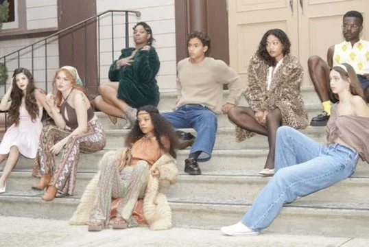 Seven young women sitting on front steps of a building, dressed in casual and stylish clothing, with varied poses and expressions.Photographer, for hire, Oceanside, Carlsbad, San Diego, Orange County, Fashion, Portraits, Moments, Lifestyle, Events,