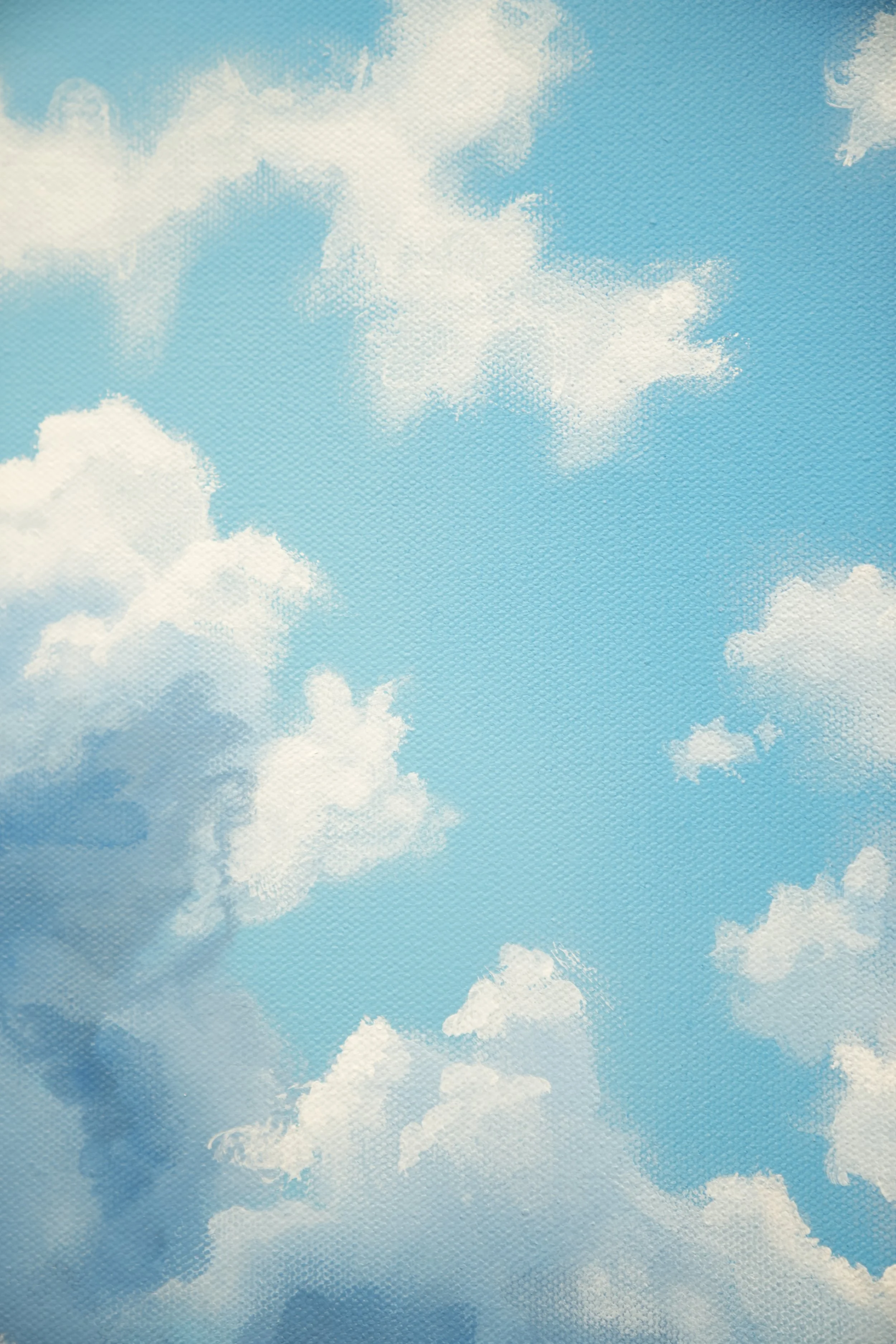Blue sky with scattered white clouds.