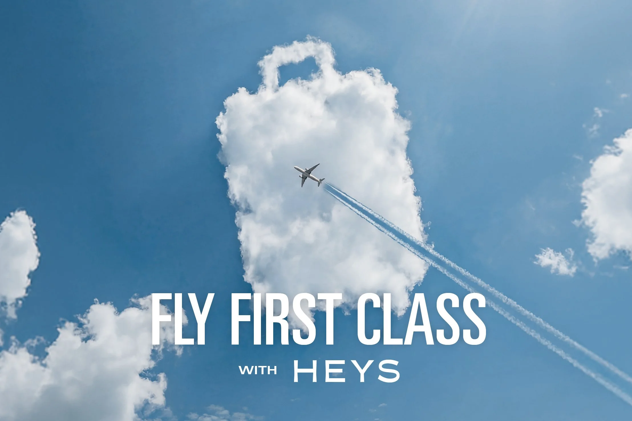 An airplane flying in the sky among clouds with the text 'Fly first class with Heys' overlaid on the image.
