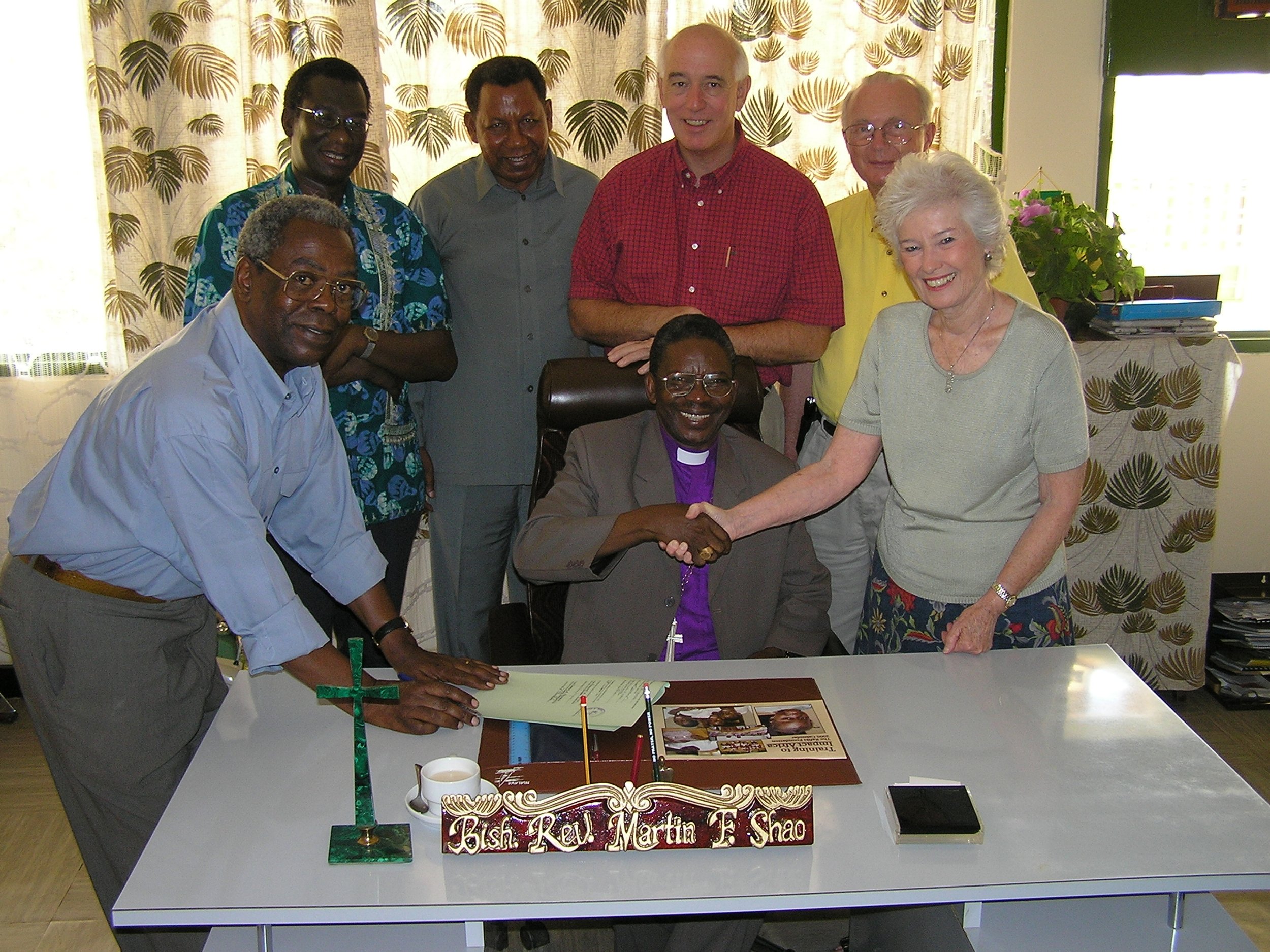 Signing for the land in Tanzania with Lutheran church officials