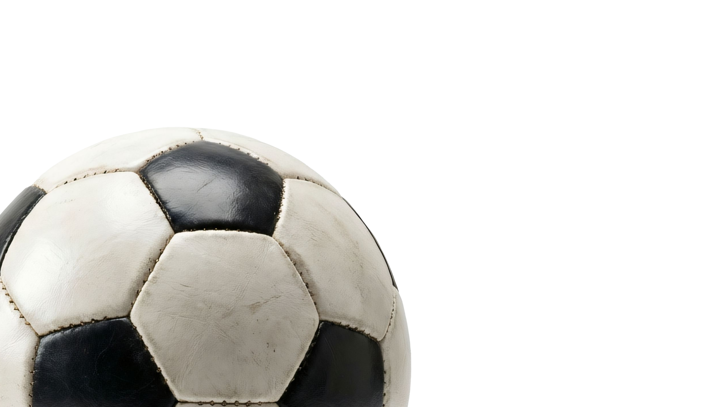 Close-up of a worn black and white soccer ball.