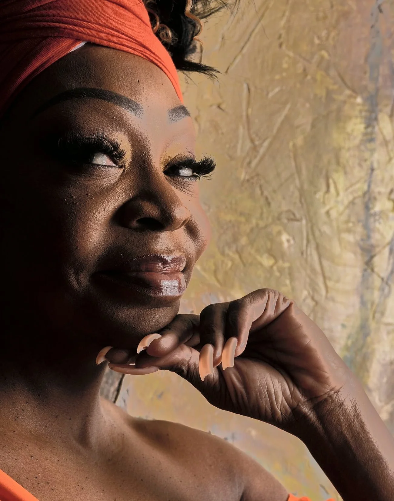 Cynthia Atkins smiling, her chin resting on her hand