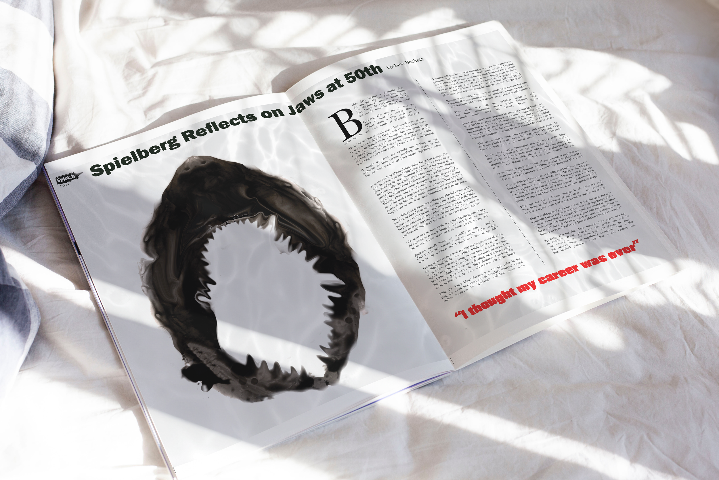A newspaper on a white sheet with a torn hole in the shape of a ring, and a red quote at the bottom right.