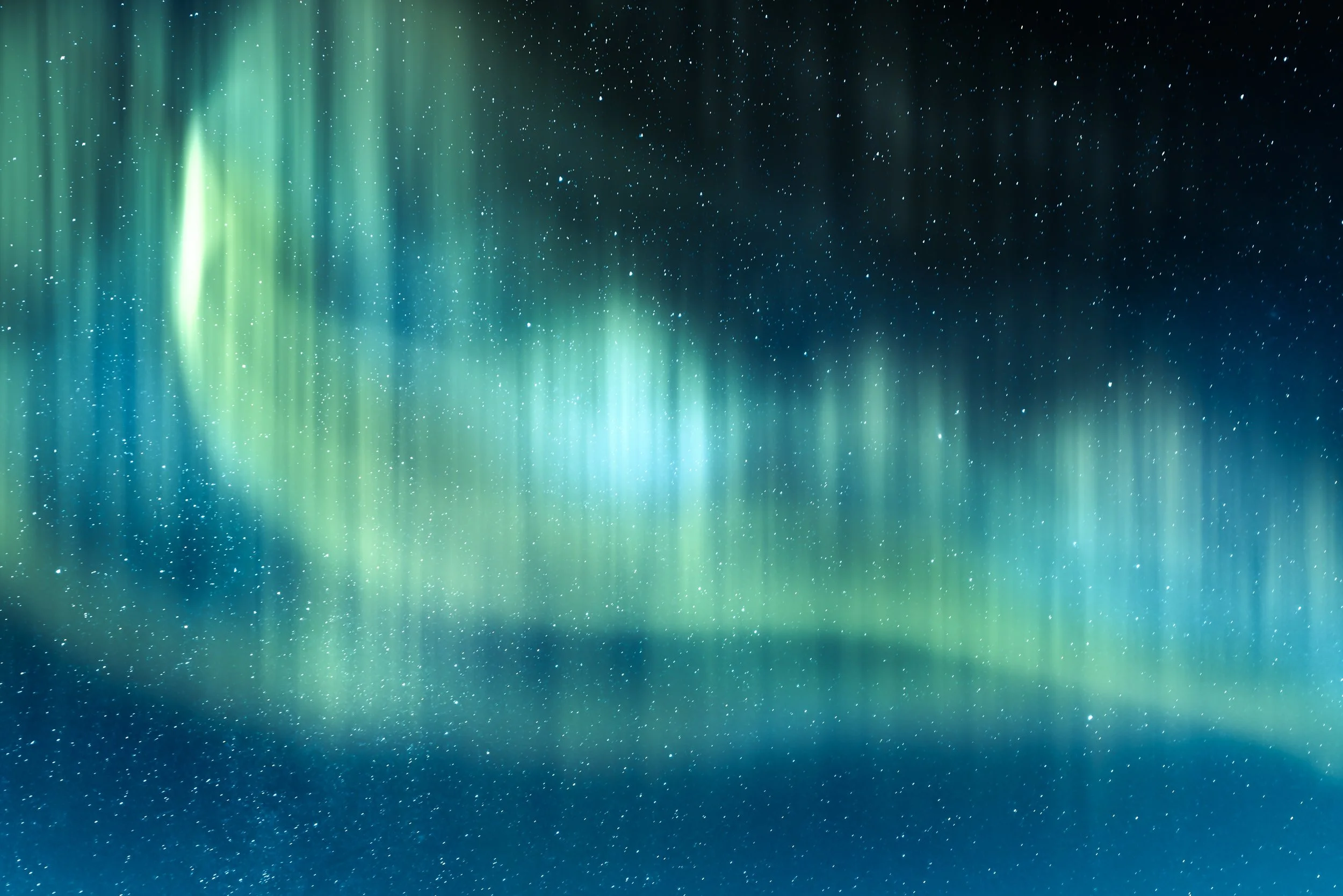 Northern Lights (Aurora Borealis) in the night sky with stars.
