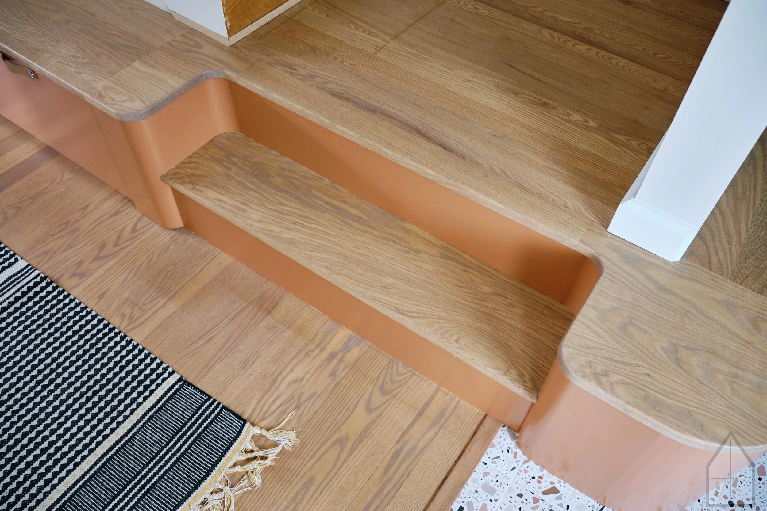 integrating stairs into cabinetry to feel like once space