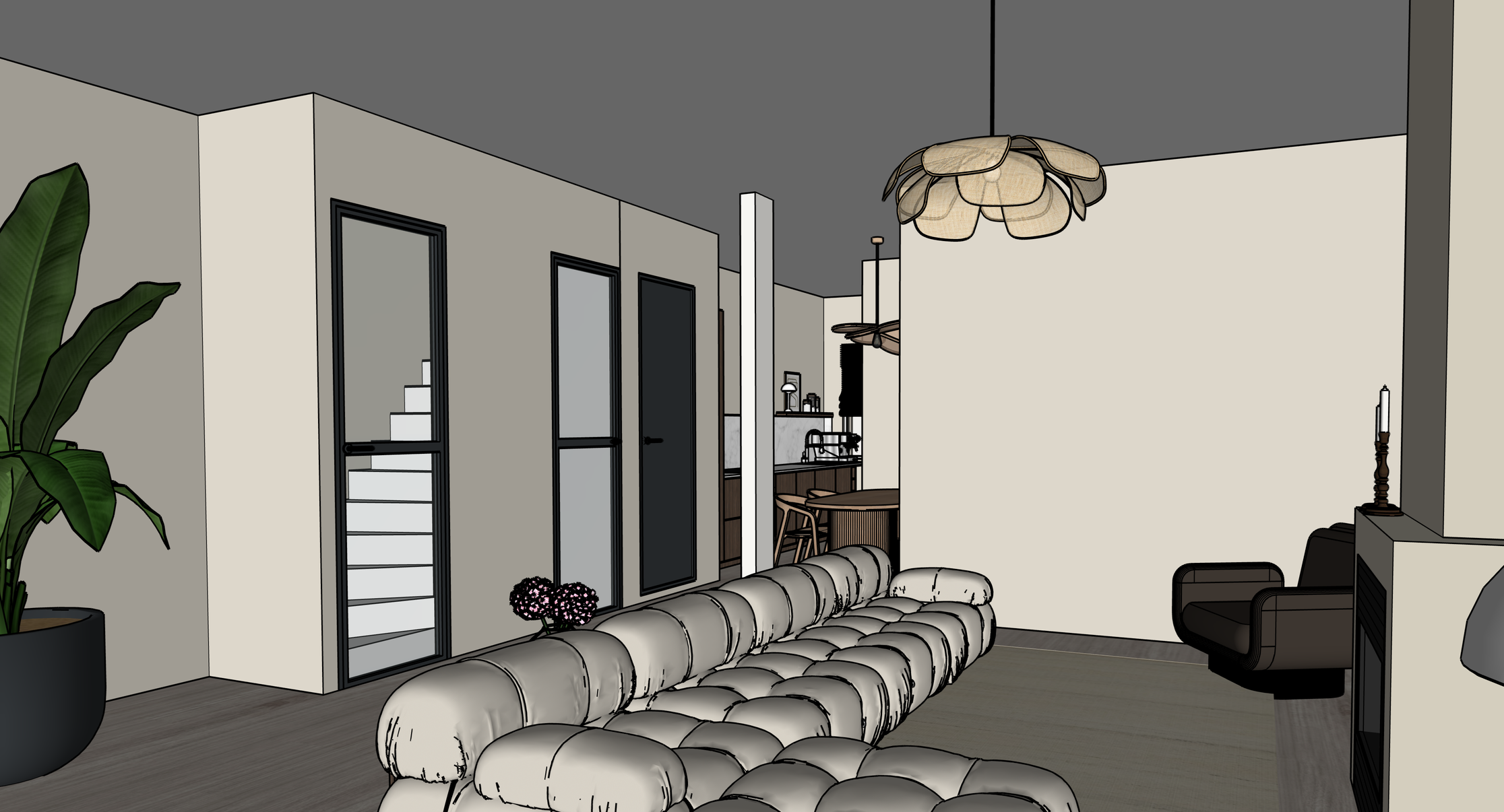 Interior view of a modern living room with a large beige tufted sofa, a black armchair, and a potted plant with broad green leaves. There are doors with black frames, a decorative chandelier, and a side table with a candle.