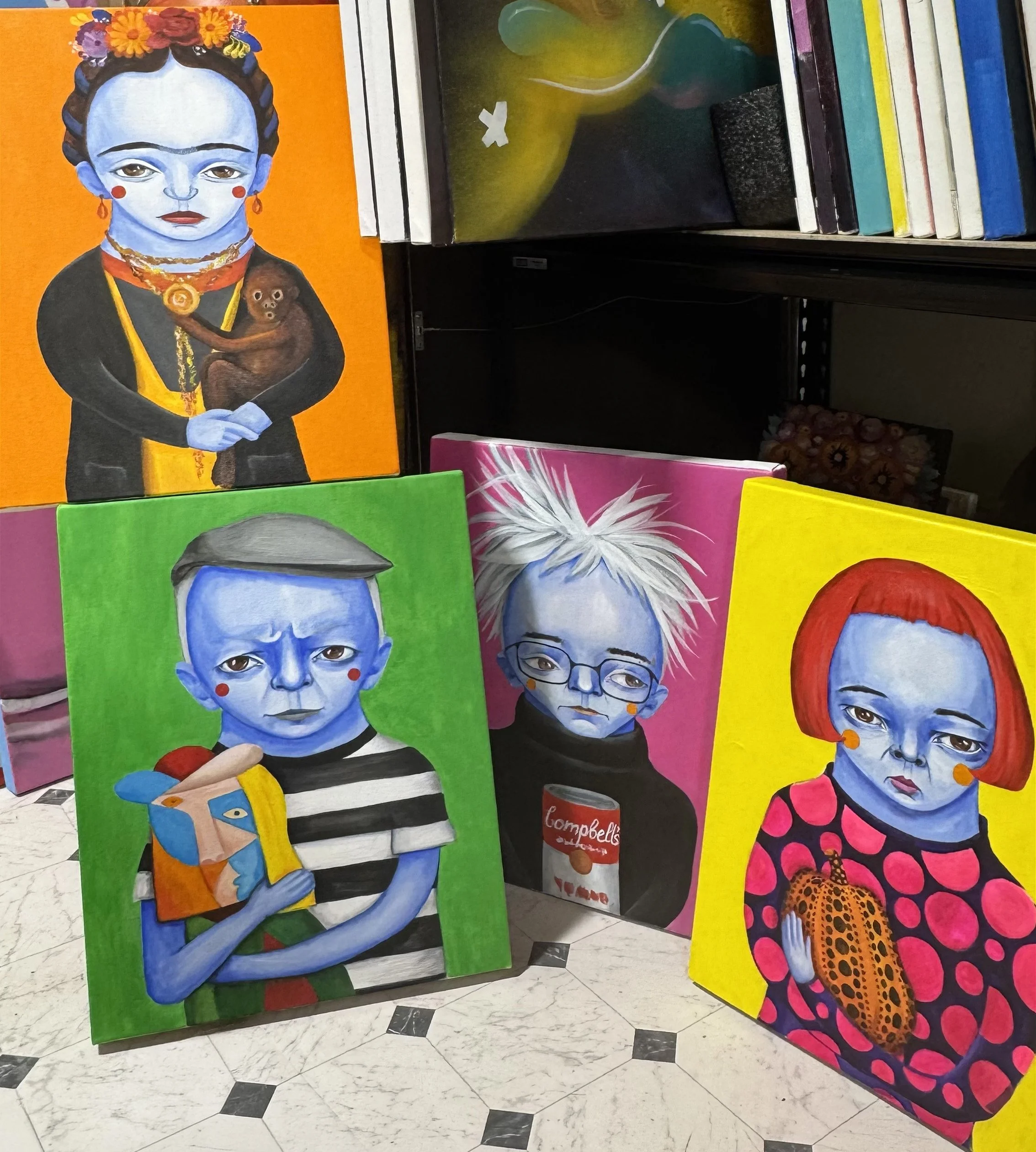 Four paintings from the Legends series — art history greats rendered in AnnaV's signature blue-skinned portrait style, each holding what they made famous