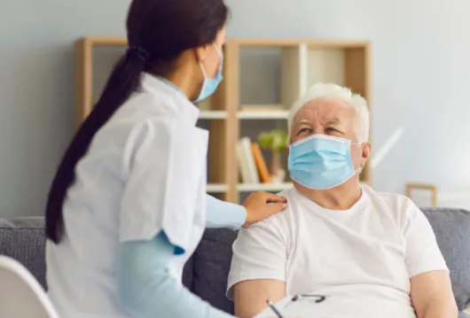 nurse with patient wearing masks