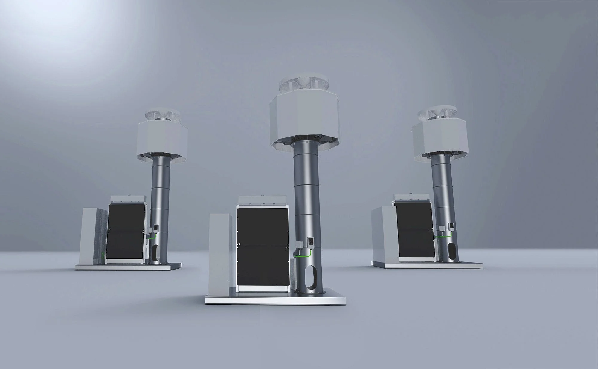 Three tall, gray and black electronic or industrial devices with large vertical black panels, connected to metallic structures with multiple base supports, set against a gray background.