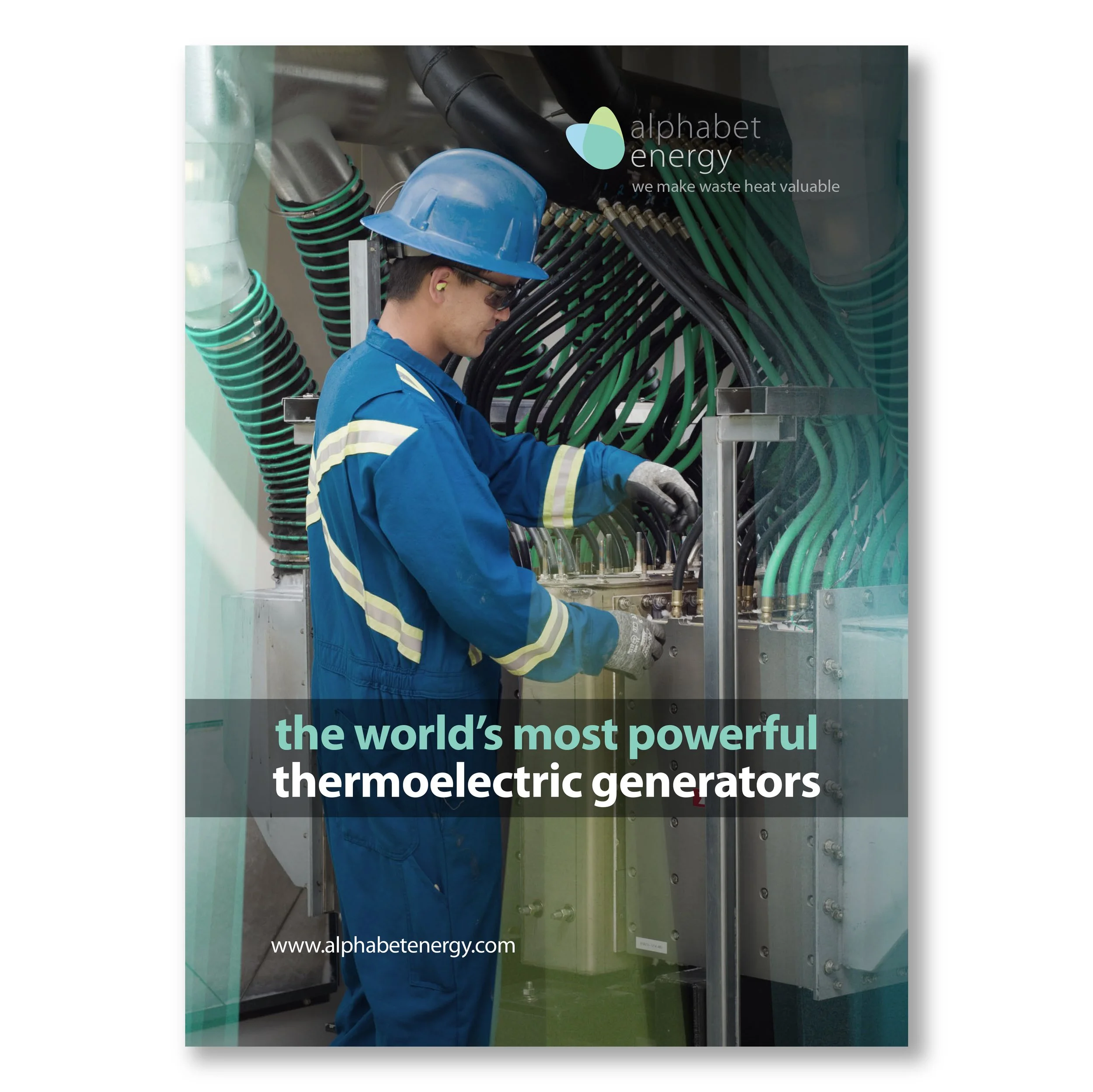 A worker in protective gear inspecting a large industrial thermo-electric generator with numerous green and black cables, in an industrial setting.